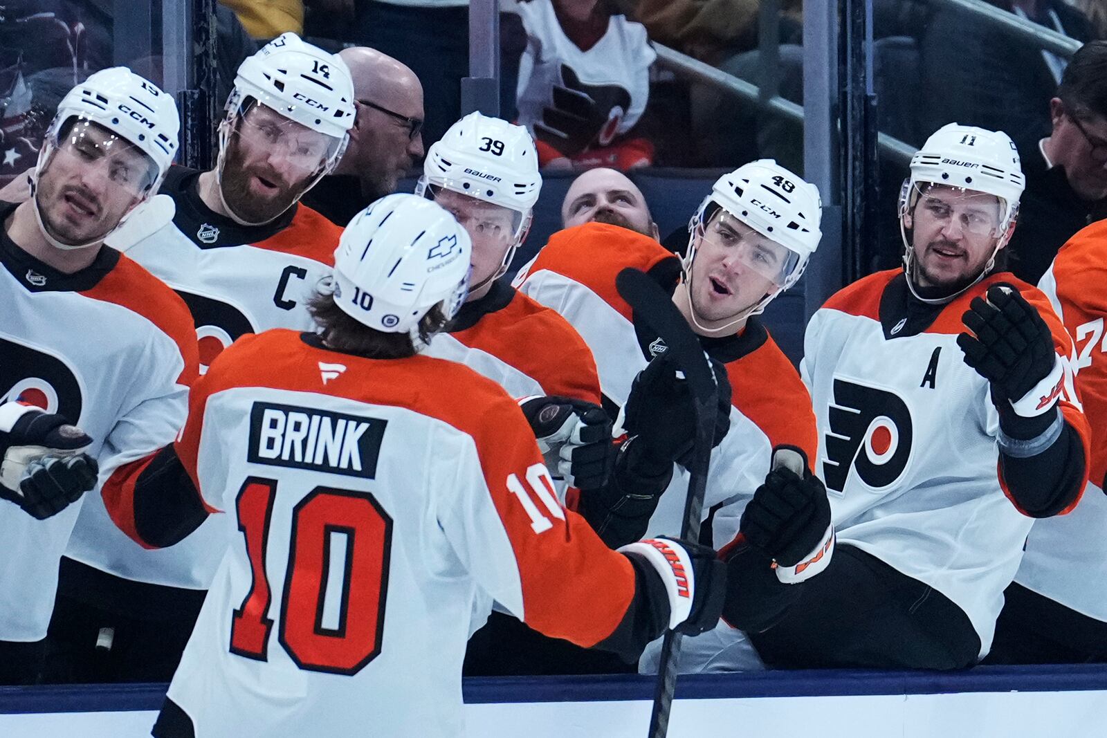 Philadelphia Flyers right wing Bobby Brink (10) is congratulated by teammates after scoring in the first period of an NHL hockey game against the Columbus Blue Jackets Tuesday, Jan. 14, 2025, in Columbus, Ohio. (AP Photo/Sue Ogrocki)