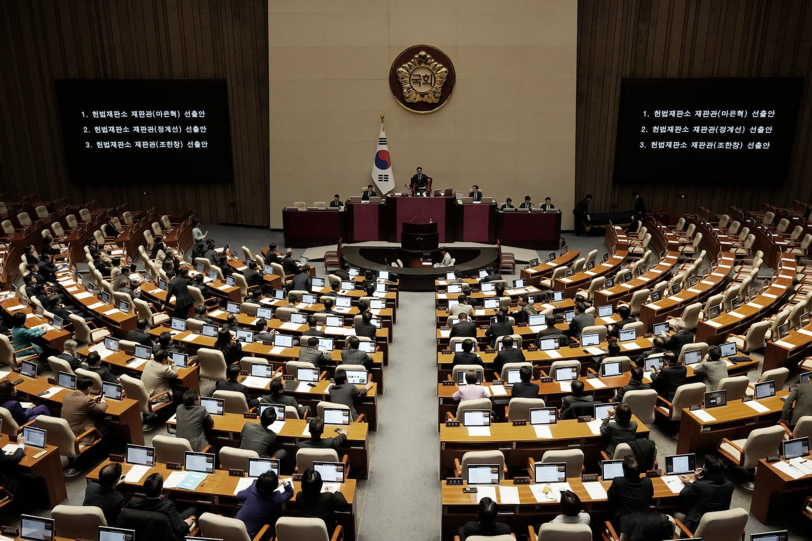 Lawmakers participate in the plenary session at the National Assembly in Seoul, South Korea, Thursday, Dec. 26, 2024. (AP Photo/Ahn Young-joon)