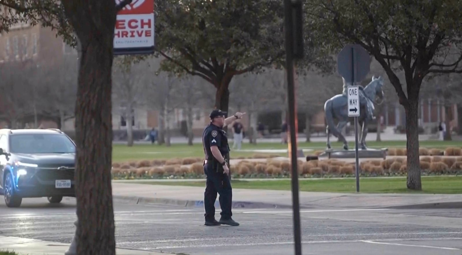 This screen grab taken from video provided by KAMC on March 12, 2025 shows a police officer directing traffic on campus at the Texas Tech University campus in Lubbock. (KAMC via AP)