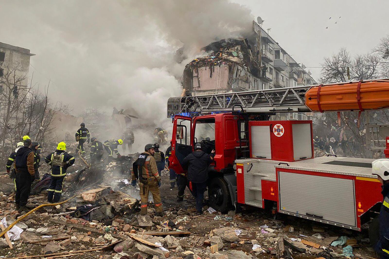 In this photo provided by the Ukrainian Emergency Service, firefighters put out the fire in the ruined apartment building following a Russian rocket attack in Poltava, Ukraine, Saturday, Feb. 1, 2025. (Ukrainian Emergency Service via AP)