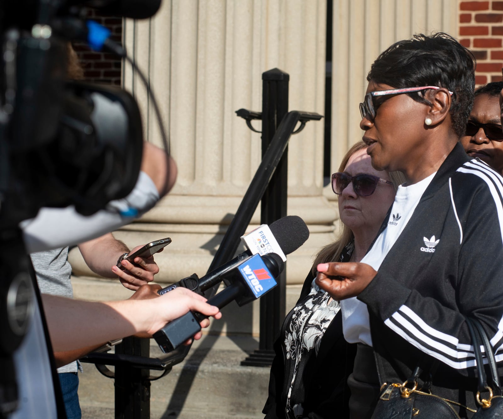 Wanda Cooper-Jones, the mother of slain jogger Ahmaud Arbery, talks with some of the news media who covered the trial of former Brunswick Circuit District Attorney Jackie Johnson, Wednesday, Feb. 5, 2025, in Brunswick, Ga. (Terry Dickson/The Brunswick News via AP, Pool)