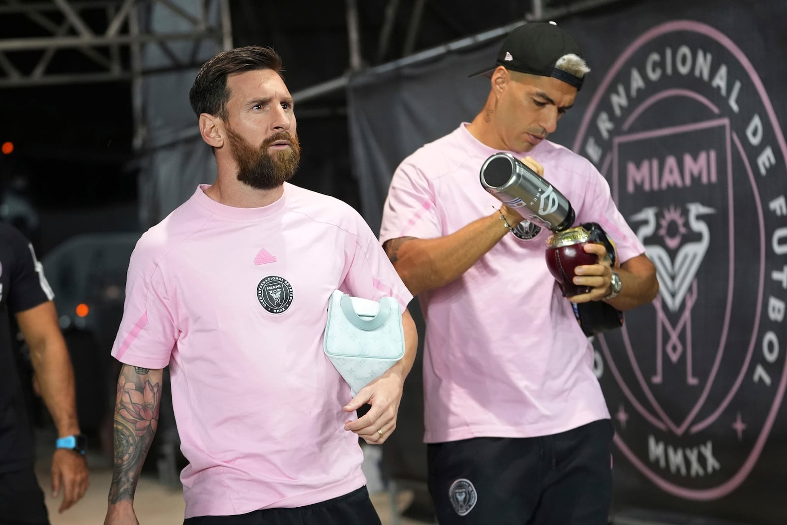 Inter Miami forwards Lionel Messi and Luis Suárez arrive for their MLS playoff opening round soccer match against the Atlanta United, Saturday, Nov. 9, 2024, in Fort Lauderdale, Fla. (AP Photo/Lynne Sladky)