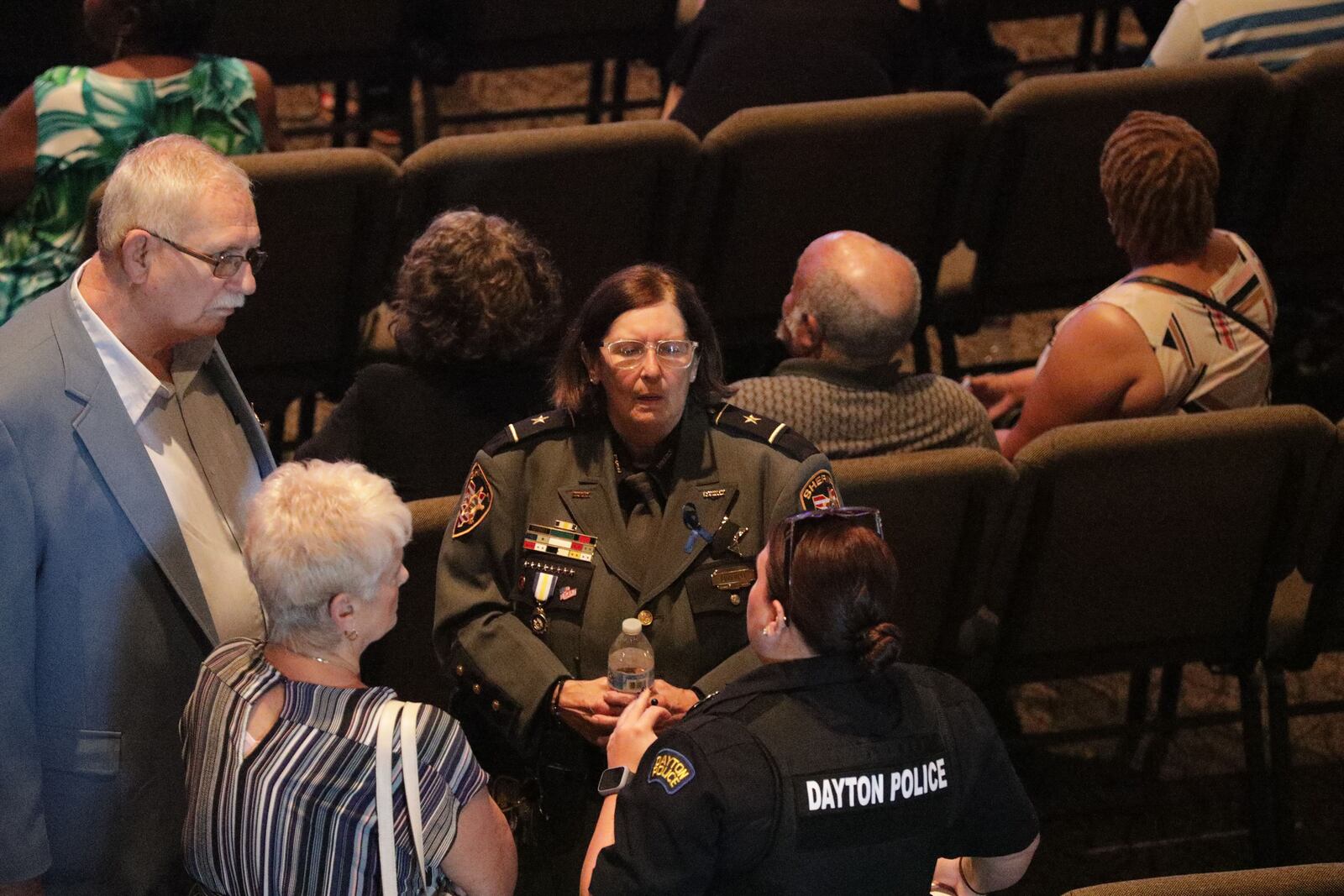 Clark County Sheriff Deborah Burchett is shown, center, at the public calling hours for  Clark County Sheriff's Deputy Matthew Yates on Sunday, July 31, 2022. BILL LACKEY/ STAFF