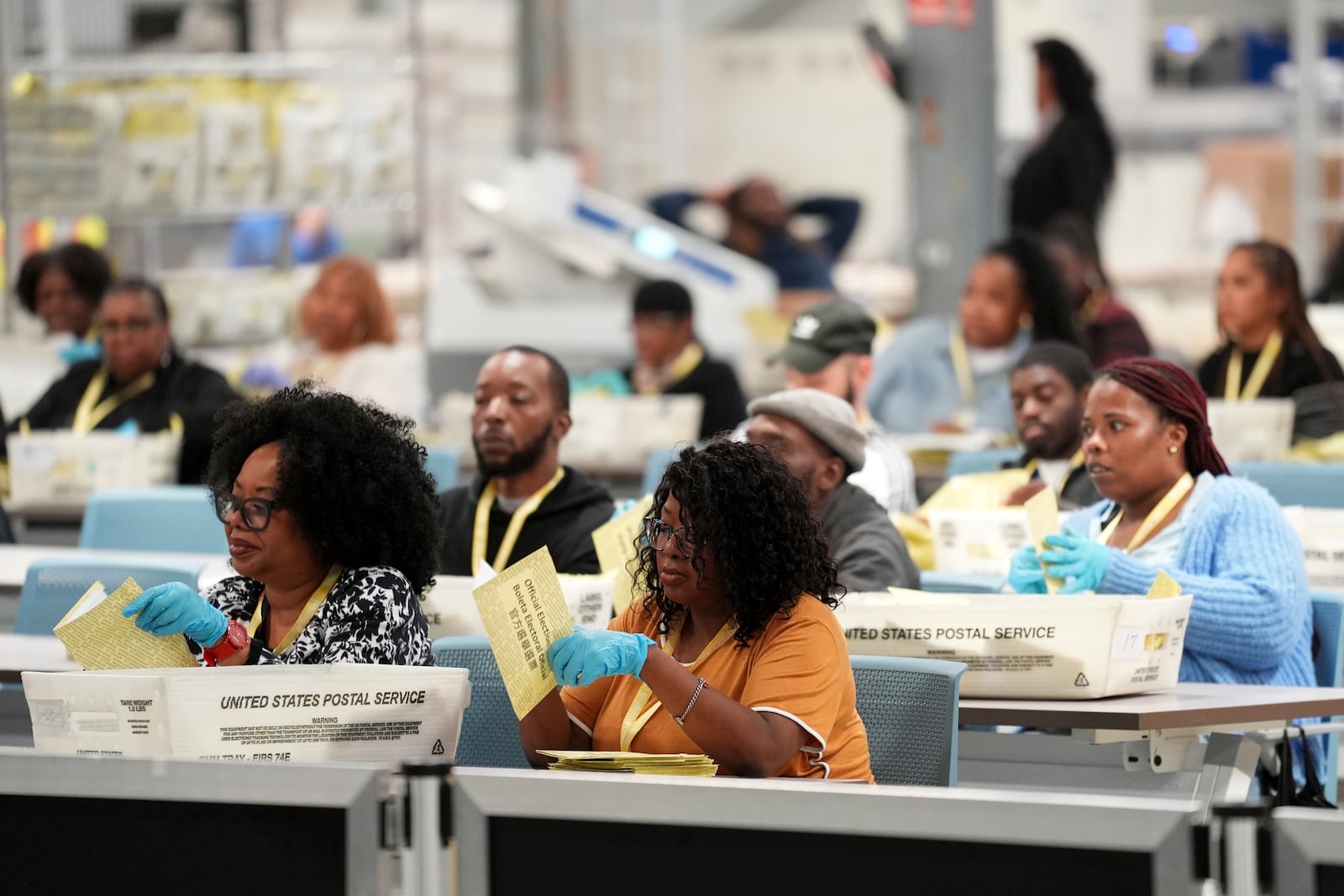 Election workers process mail-in ballots for the 2024 General Election at the Philadelphia Election Warehouse, Tuesday, Nov. 5, 2024, in Philadelphia. (AP Photo/Matt Rourke)