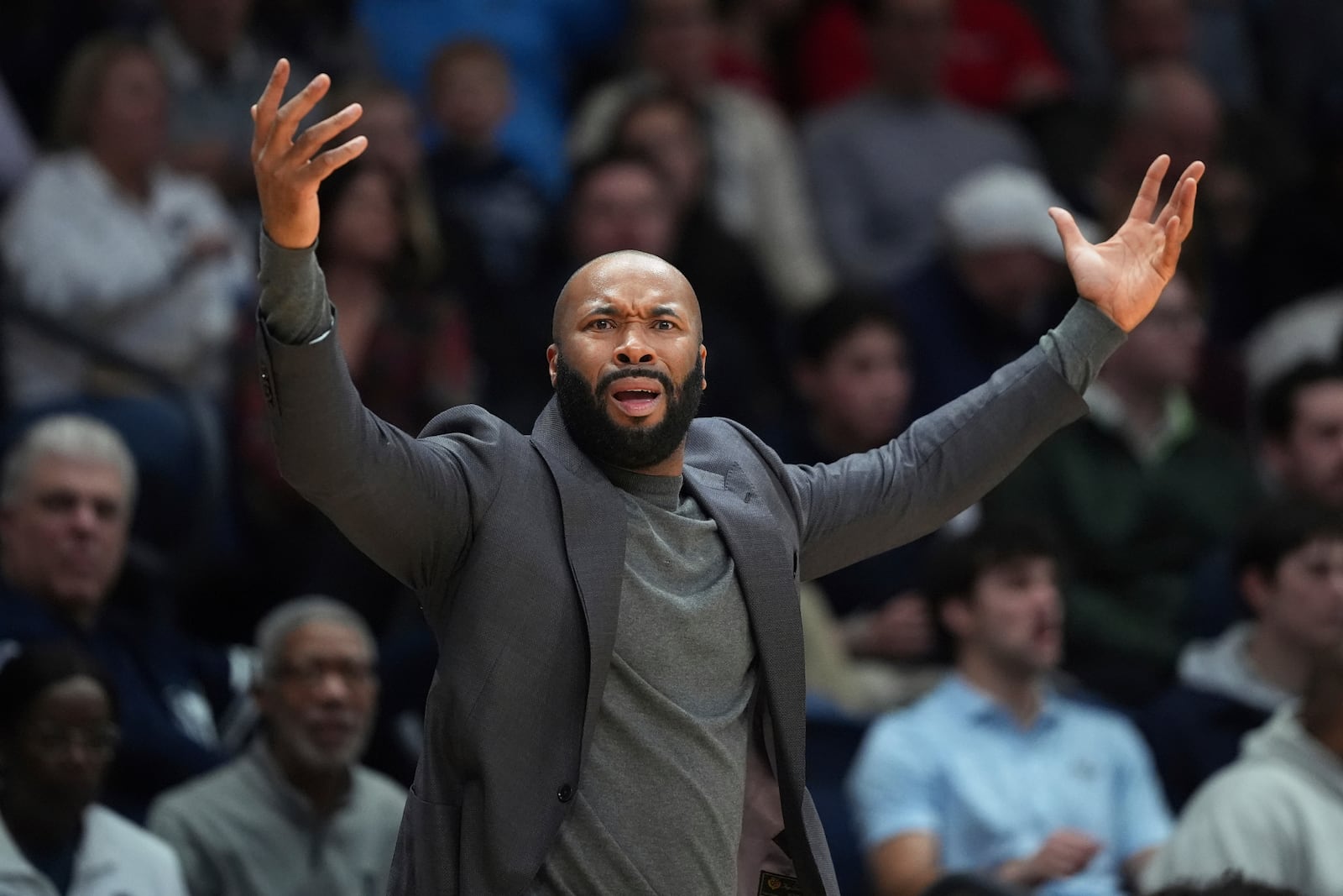 Villanova's Kyle Neptune reacts during the first half of an NCAA college basketball game against St. John's, Wednesday, Feb. 12, 2025, in Villanova, Pa. (AP Photo/Matt Slocum)