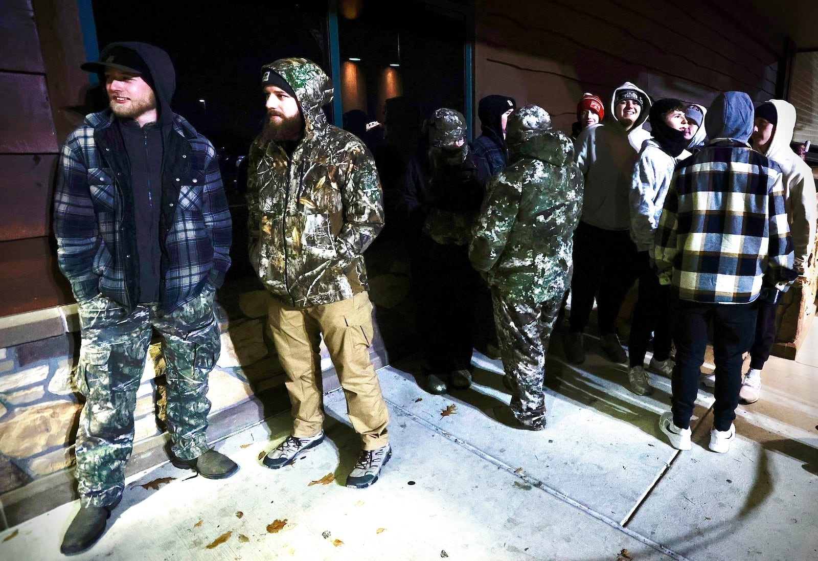 Dalton Michael (left) and Christian Rembold (right) of Springfield waiting outside of Cabela's in Centerville on Friday, Nov. 29, waiting for the store to open with Black Friday deals. MARSHALL GORBY/STAFF