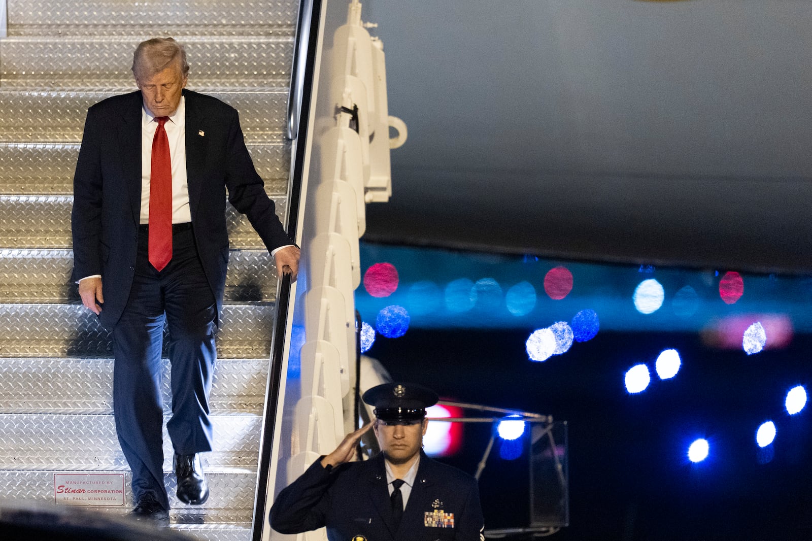 President Donald Trump arrives on Air Force One at Palm Beach International Airport, Friday, March 14, 2025, in West Palm Beach, Fla. (AP Photo/Manuel Balce Ceneta)