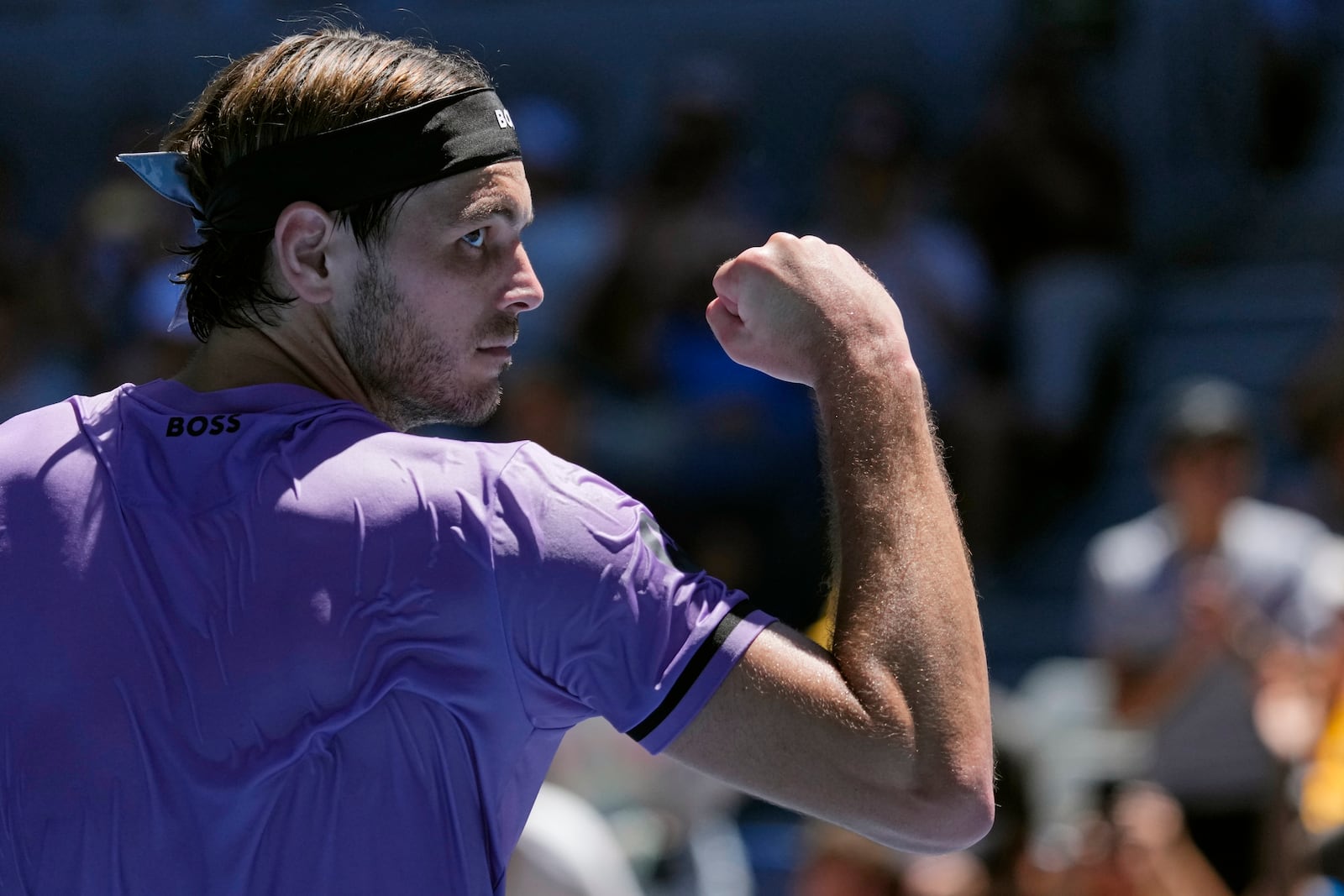 Taylor Fritz of the U.S. reacts after defeating compatriot Jenson Brooksby in their first round match at the Australian Open tennis championship in Melbourne, Australia, Tuesday, Jan. 14, 2025. (AP Photo/Vincent Thian)