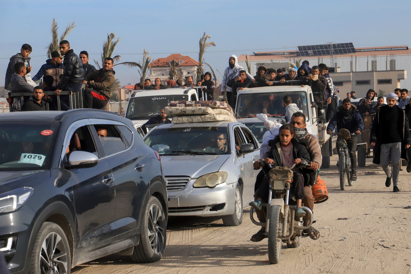 Displaced Palestinians return to Rafah, as a ceasefire deal between Israel and Hamas went into effect, in Rafah, Gaza Strip, Sunday, Jan. 19, 2025. (AP Photo/Mariam Dagga)