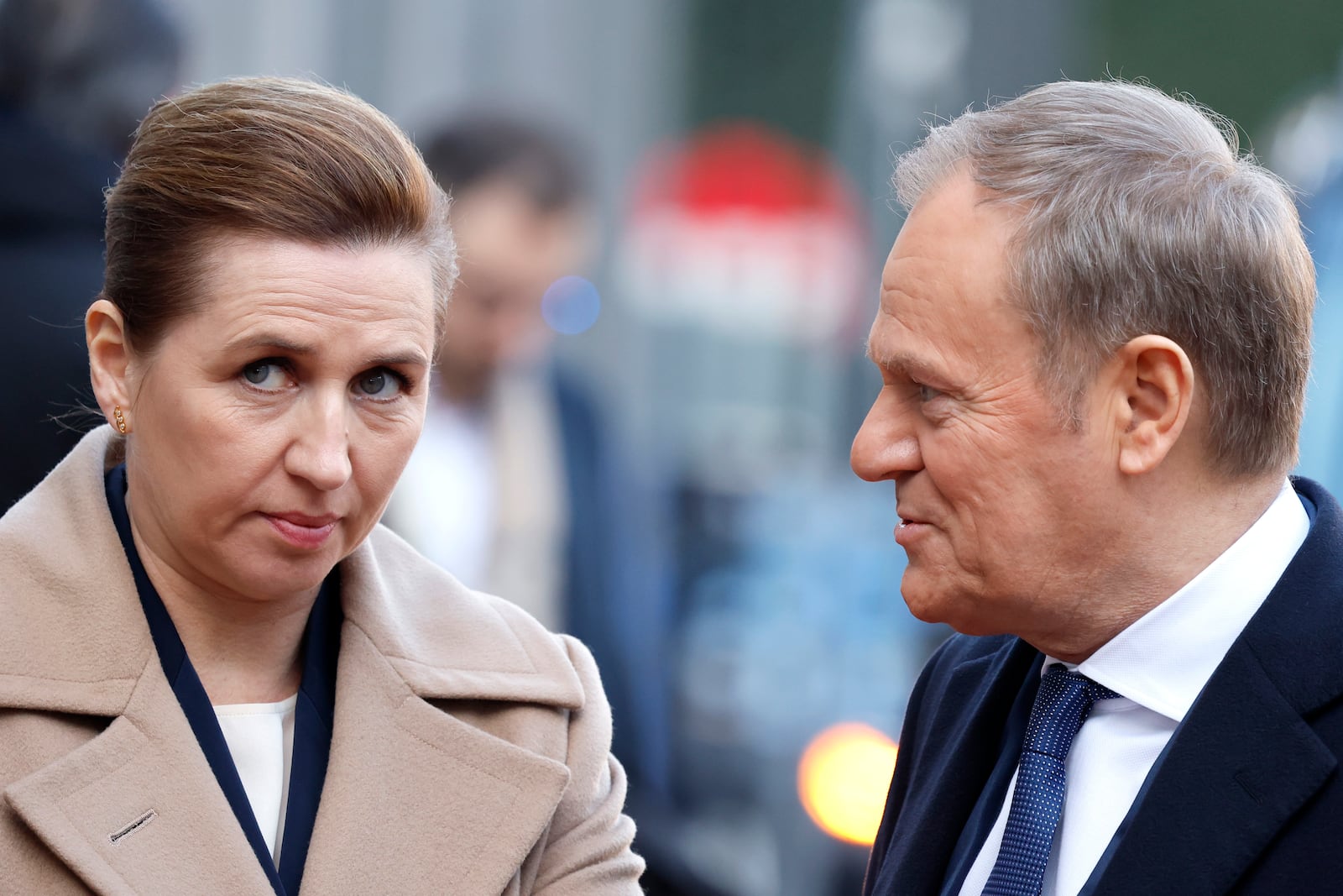 Denmark's Prime Minister Mette Frederiksen, left, speaks with Poland's Prime Minister Donald Tusk as they arrive for an EU summit at the Egmont Palace in Brussels, Monday, Feb. 3, 2025. (AP Photo/Geert Vanden Wijngaert)