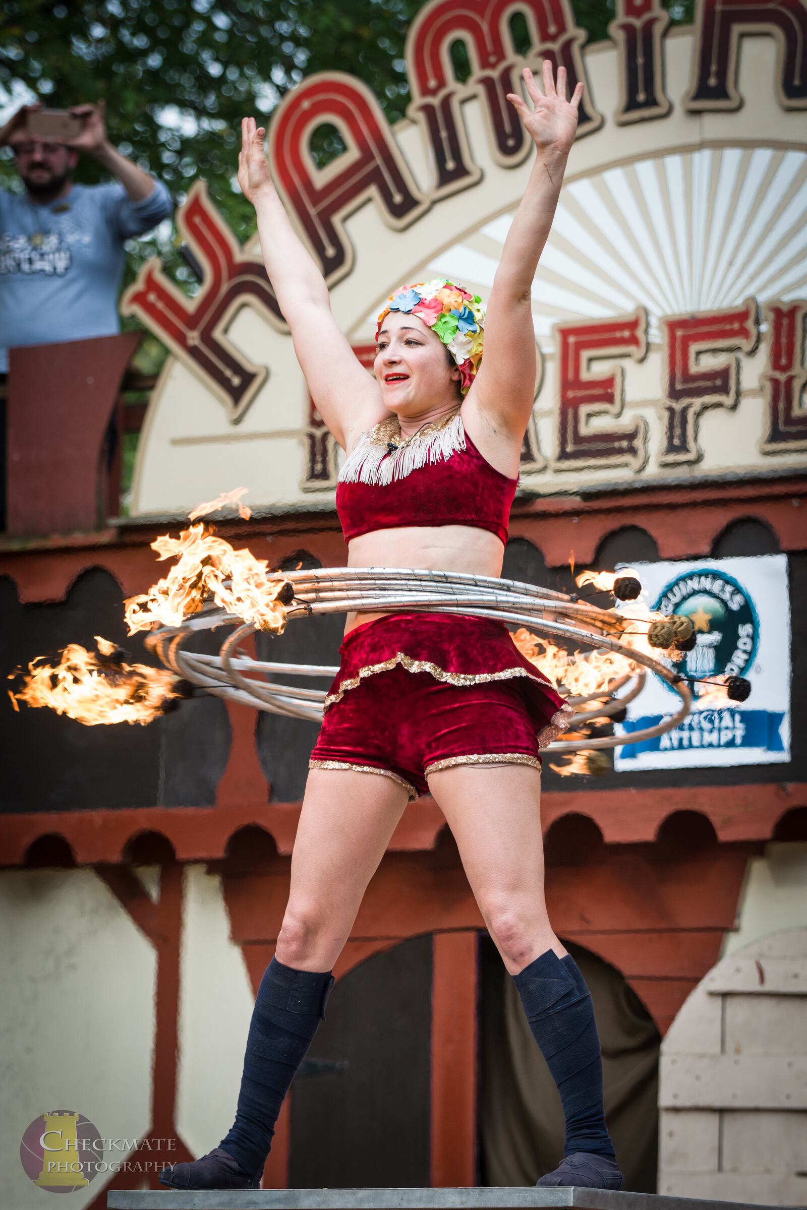 Casey Martin of the performing duo the KamiKaze FireFlies broke her own world Guinness World Record  for the most flaming hula hoops on the body at the Ohio Renaissance Festival near Waynesville Sunday, Sept. 29.