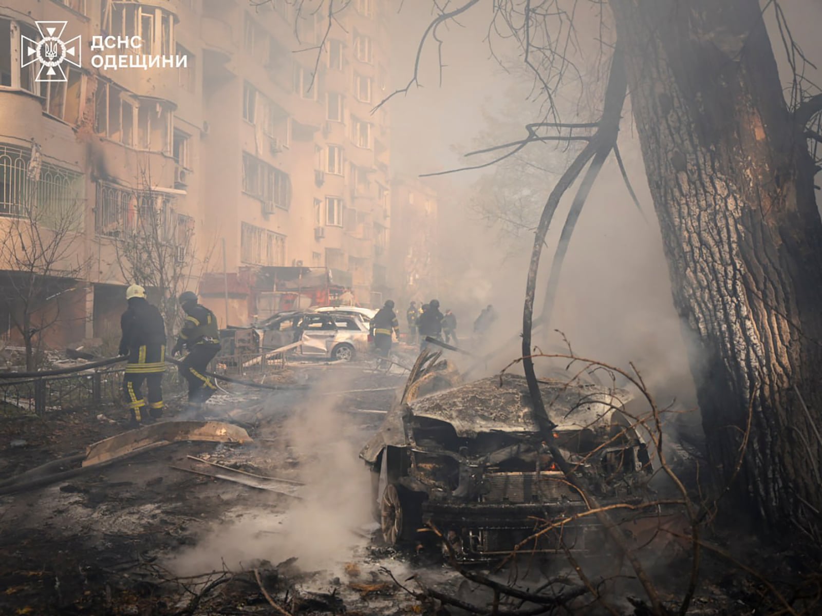 In this photo provided by the Ukrainian Emergency Service, emergency services personnel work to extinguish a fire following a Russian rocket attack in Odesa, Ukraine, Monday, Nov. 18, 2024. (Ukrainian Emergency Service via AP)