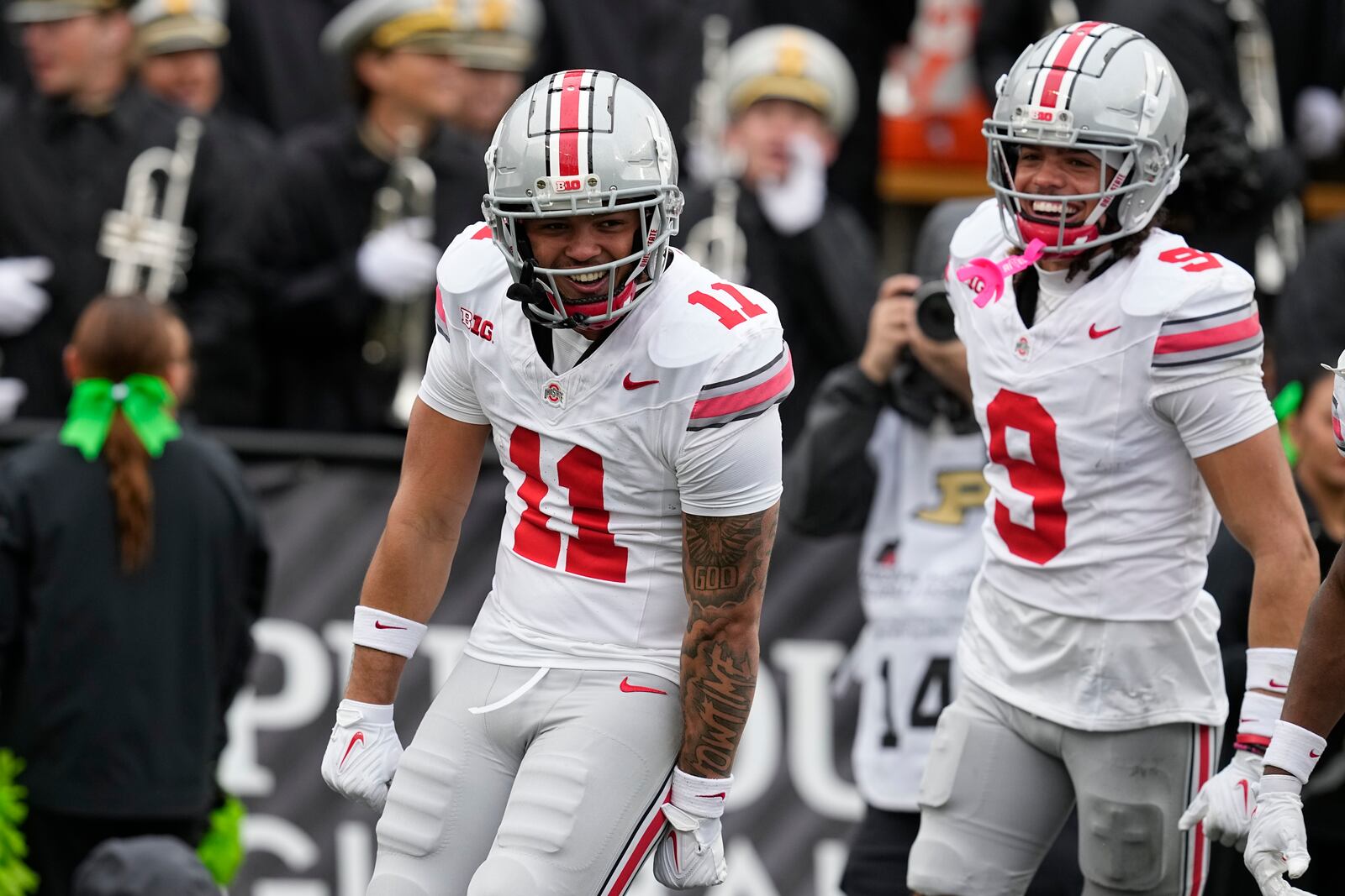 Ohio State wide receiver Brandon Inniss (11) celebrates a touchdown reception with Jayden Ballard (9) during the second half of an NCAA college football game against Purdue, Saturday, Oct. 14, 2023, in West Lafayette, Ind. Ohio State won 41-7. (AP Photo/Darron Cummings)