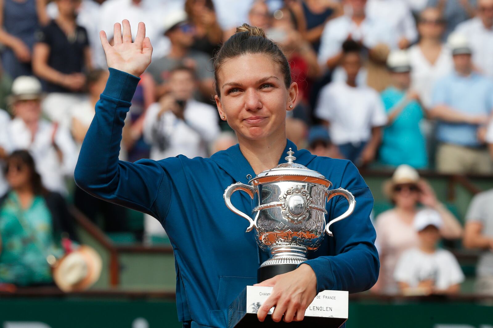 FILE - Romania's Simona Halep celebtrates with the trophy after defeating against Sloane Stephens, of the United States, in the finals of the French Open tennis tournament, Saturday, June 9, 2018, at the Roland Garros stadium in Paris, France. (AP Photo/Michel Euler, File)