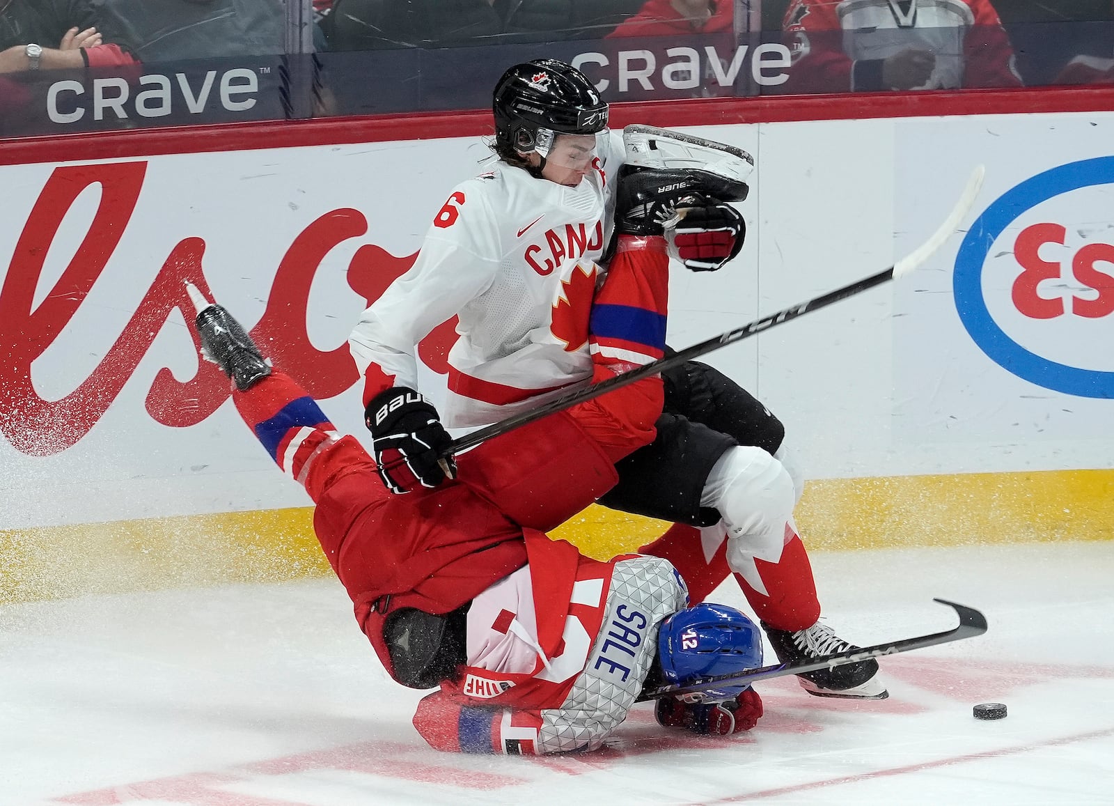 Canada defenseman Tanner Molendyk (6) collides with Czech Republic forward Eduard Sale during the third periodof a quarterfinal match at the world junior hockey championship in Ottawa, Ontario, Thursday, Jan. 2, 2025. (Adrian Wyld/The Canadian Press via AP)