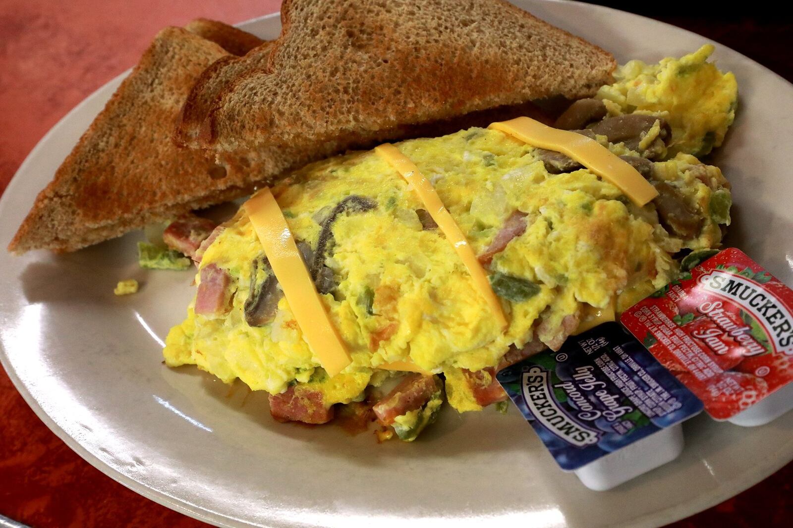 A fresh omelette made at Loretta’s Country Kitchen. BILL LACKEY/STAFF