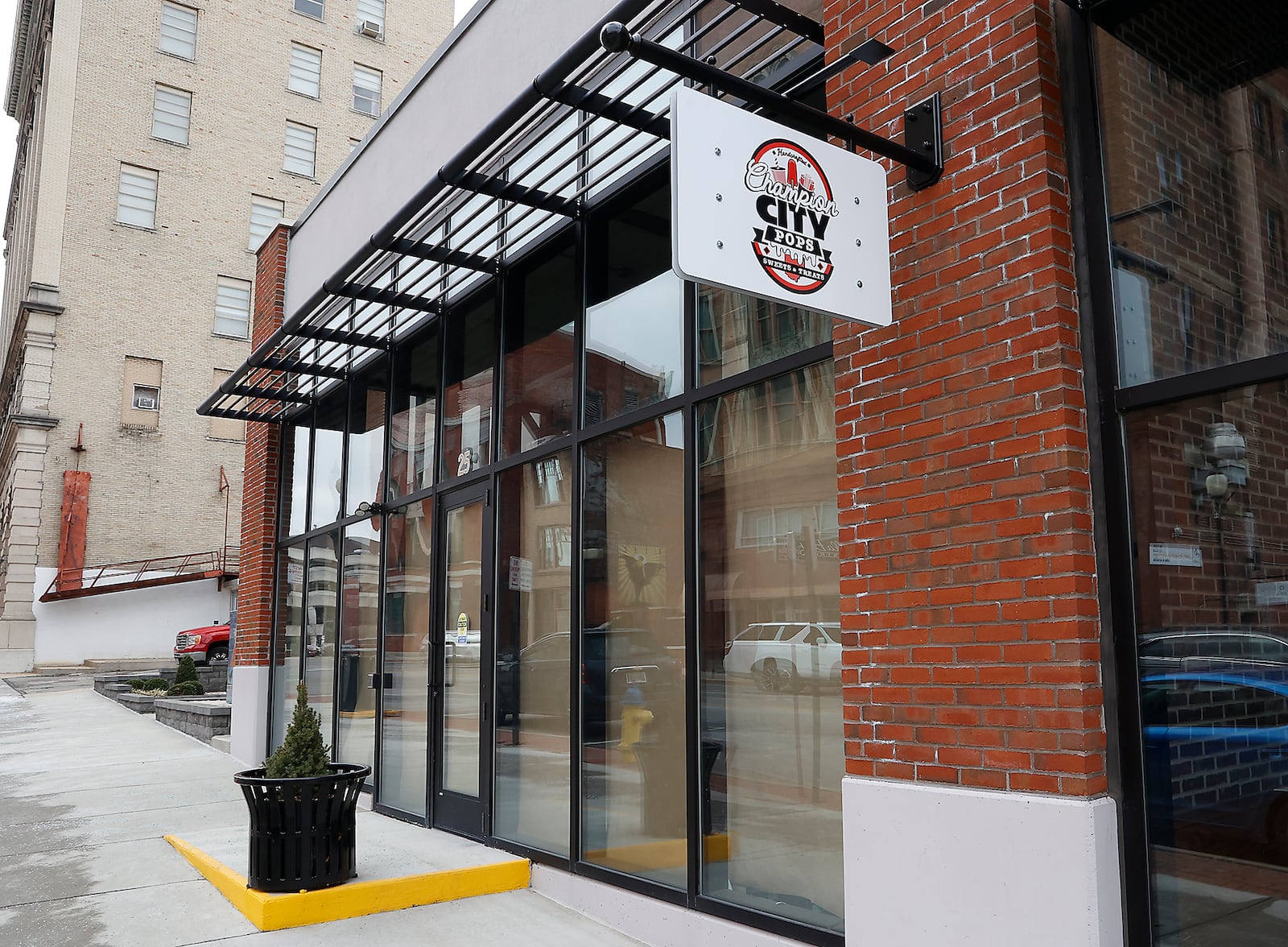 The sign for Champion City Pops has gone up at the vacant space next to Charlo's along South Fountain Avenue in downtown Springfield. BILL LACKEY/STAFF