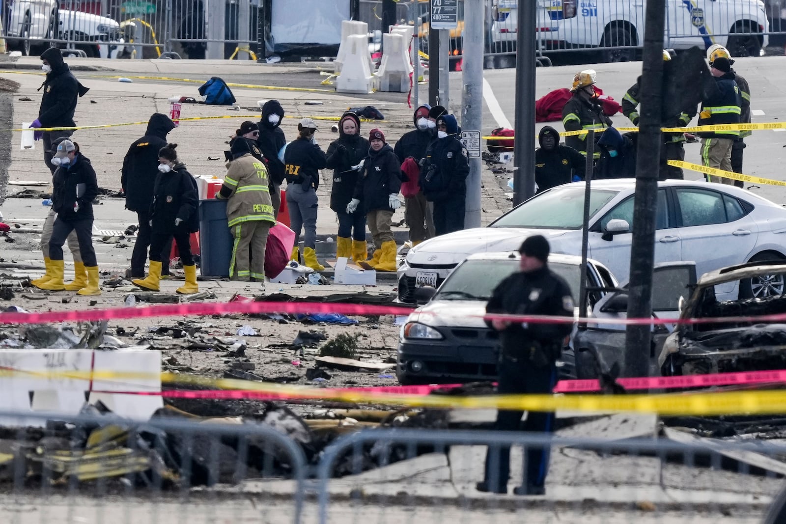 Investigators work the scene after a small plane crashed in Philadelphia, Saturday, Feb. 1, 2025. (AP Photo/Matt Rourke)