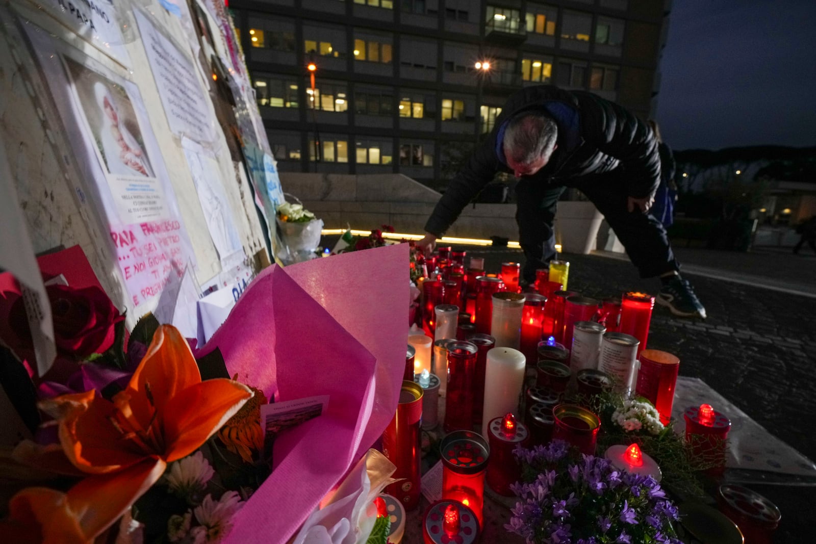 Candles for Pope Francis are seen in front of the Agostino Gemelli Polyclinic, in Rome, Friday, March 7, 2025, where the Pontiff is hospitalized since Friday, Feb. 14. (AP Photo/Andrew Medichini)