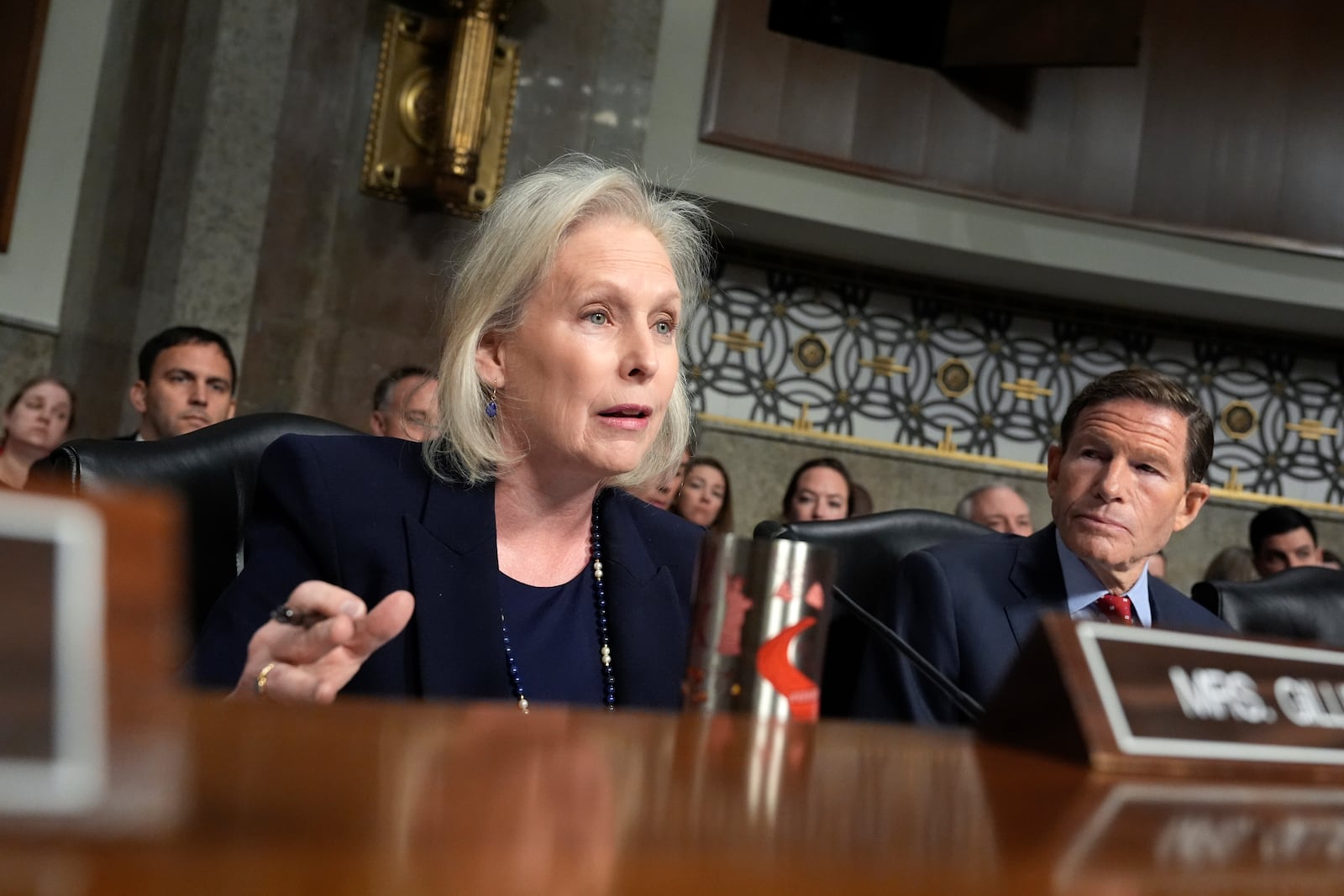 Sen. Kirsten Gillibrand, D-N.Y. speaks as Sen. Richard Blumenthal, D-Conn., right, listens at the Senate Armed Services Committee confirmation hearing for Pete Hegseth, President-elect Donald Trump's choice to be Defense secretary, at the Capitol in Washington, Tuesday, Jan. 14, 2025. (AP Photo/Alex Brandon)