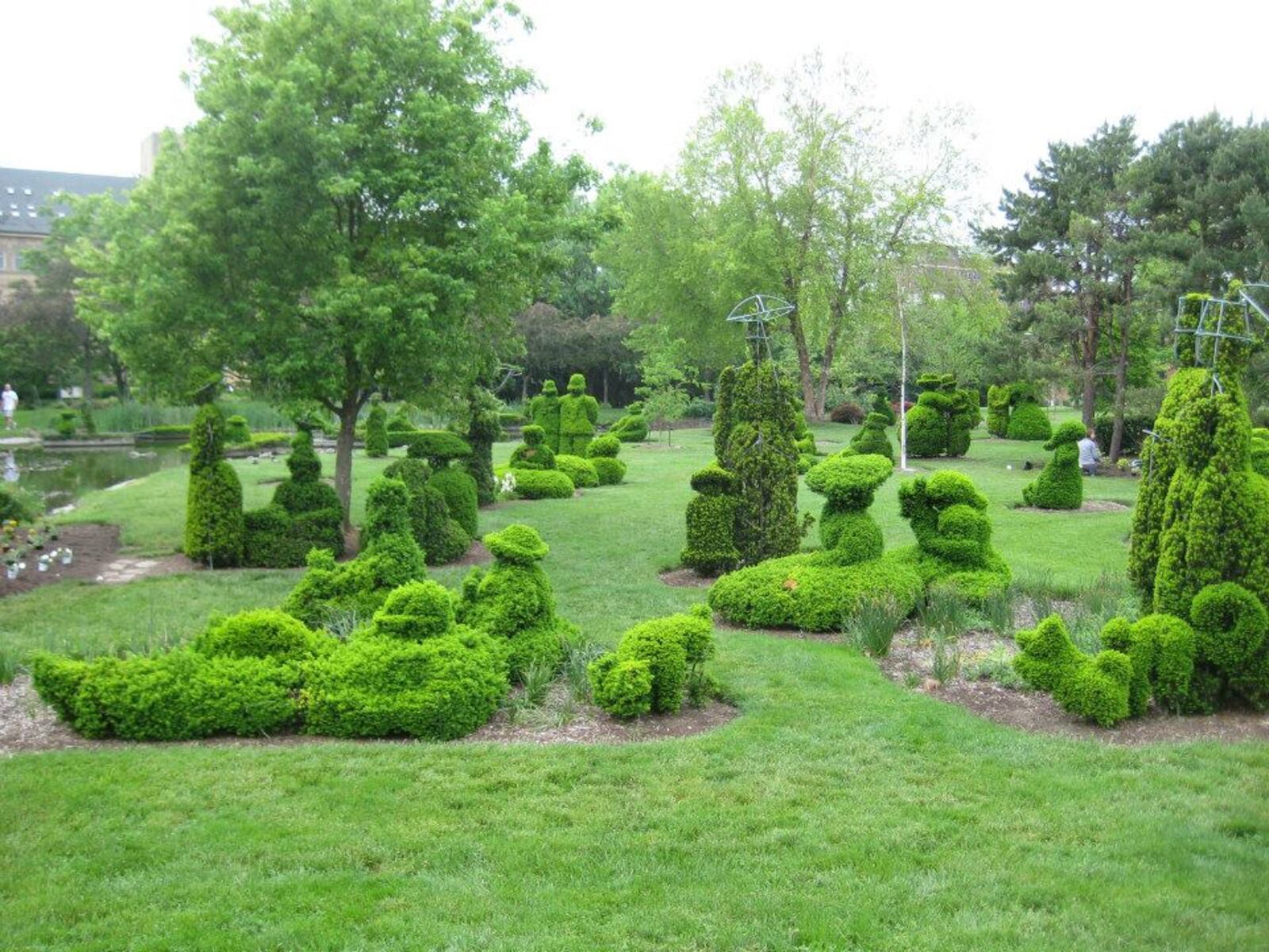 The Topiary Garden, located in downtown Columbus, is a replica of the painting "A Sunday Afternoon on the Island of LaGrande Jatte" by Georges Seurat.