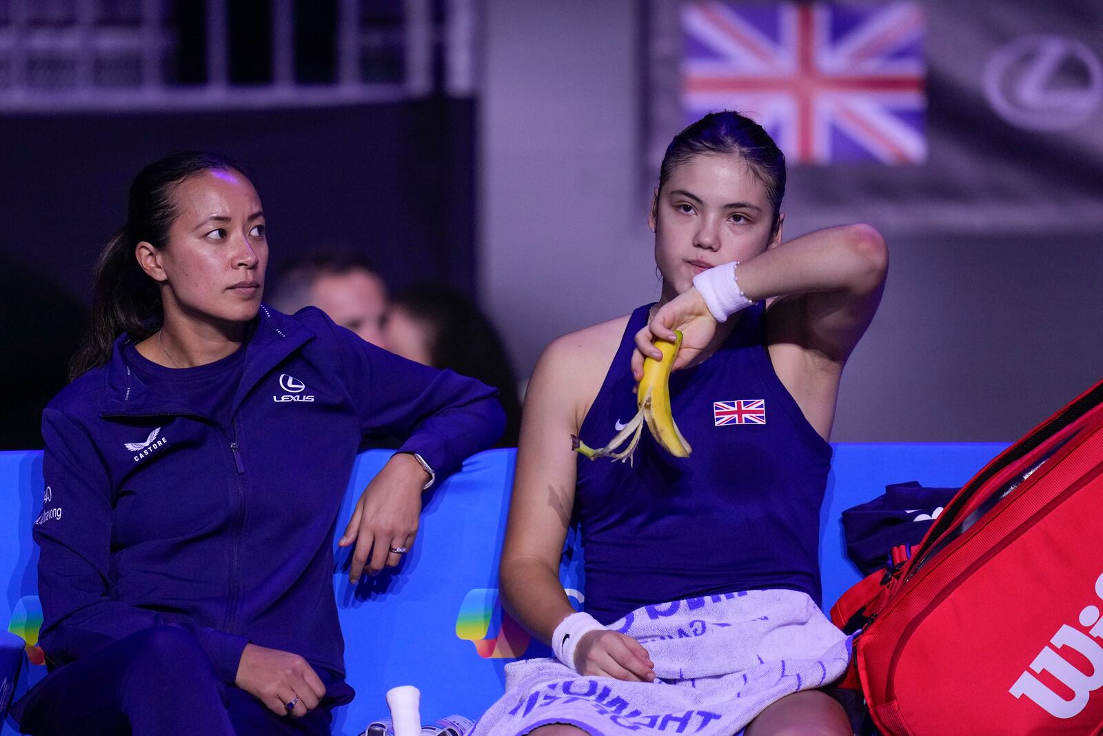 Emma Raducanu of Britain sits in her chair in a set break during her match against Germany's Jule Niemeier at the Billie Jean King Cup Finals, at the Martin Carpena Sports Hall, in Malaga, southern Spain, on Friday, Nov. 15, 2024. (AP Photo/Manu Fernandez)