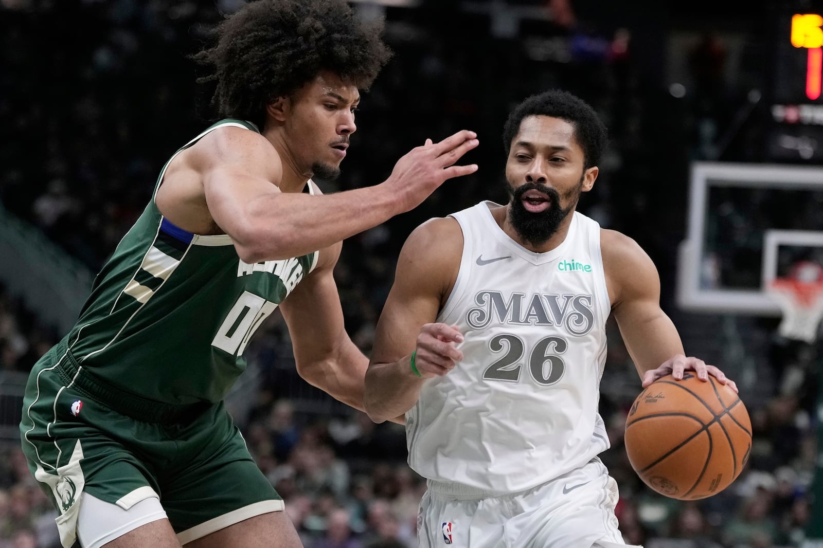 Dallas Mavericks' Spencer Dinwiddie tries to get past Milwaukee Bucks' Jericho Sims during the first half of an NBA basketball game Wednesday, March 5, 2025, in Milwaukee. (AP Photo/Morry Gash)