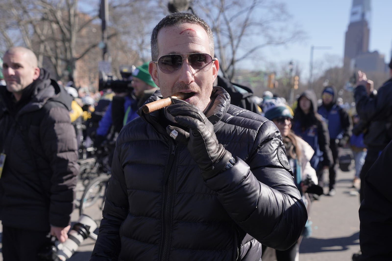 Philadelphia Eagles executive vice president and general manager Howie Roseman enjoys a cigar during the team's NFL football Super Bowl 59 parade and celebration, Friday, Feb. 14, 2025, in Philadelphia. (AP Photo/Chris Szagola)