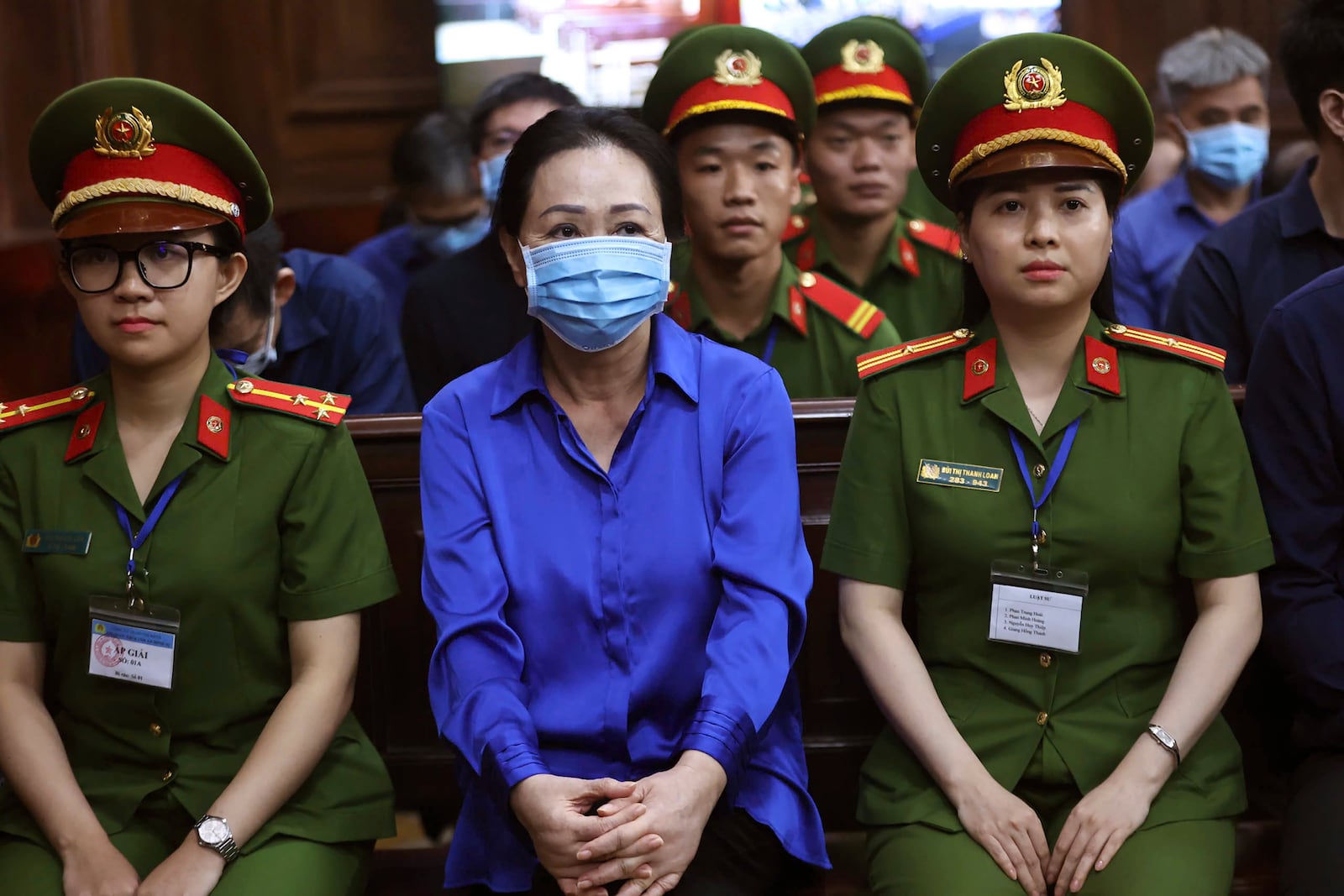 Vietnamese real estate tycoon Truong My Lan, center, sits in court to wait for her verdict on fraud, money laundering and illegal cross-border money transferring in Ho Chi Minh city, Vietnam Thursday, Oct. 17, 2024. (Quynh Tran/VnExpress via AP)