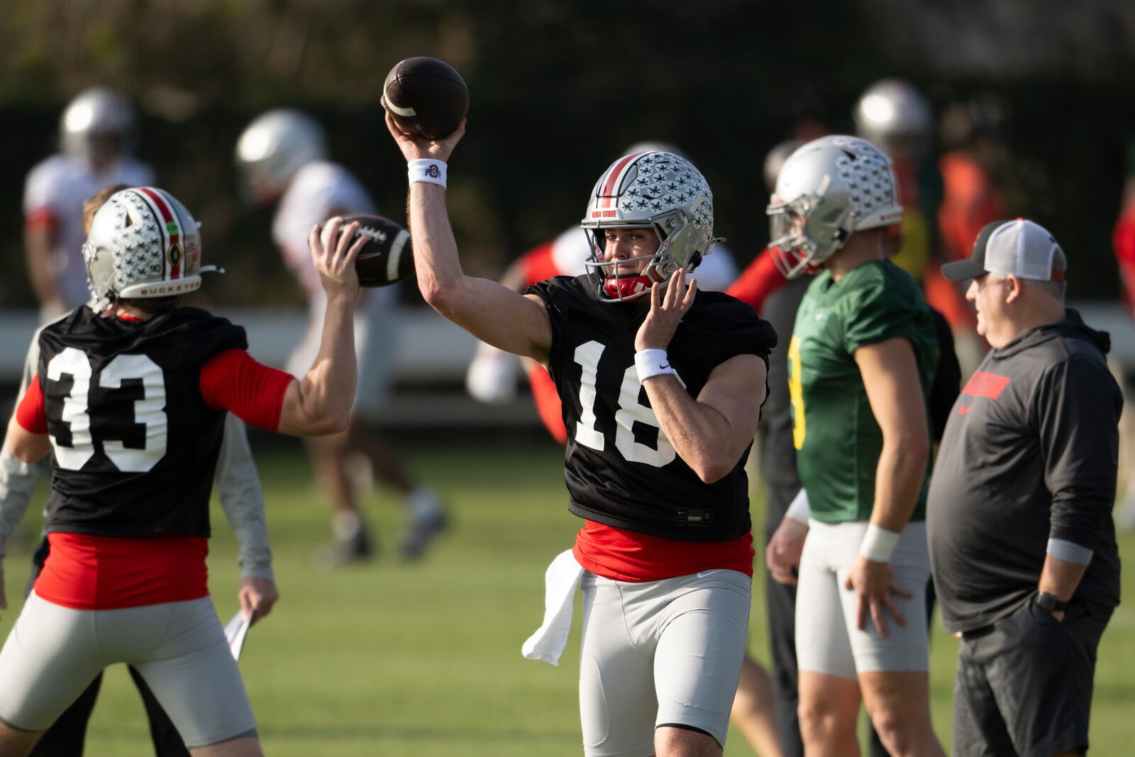 Ohio State quarterback Will Howard (18) throws during practice in Carson, Calif., Monday, Dec. 30, 2024, ahead of Wednesday's Rose Bowl College Football Playoff against Oregon. (AP Photo/Kyusung Gong)