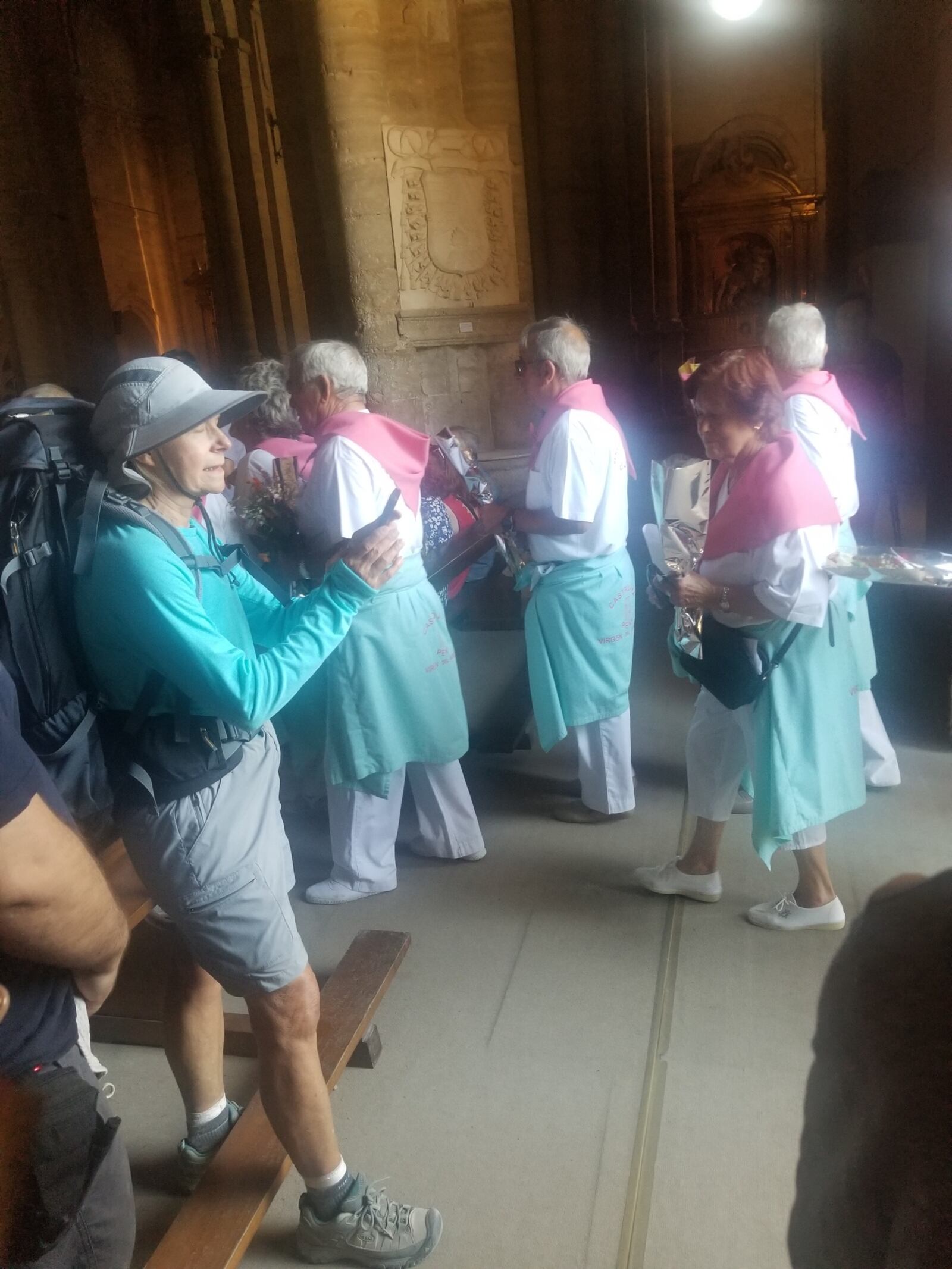 Margie Mahl snaps photos during mass in one of the many village churches. CONTRIBUTED