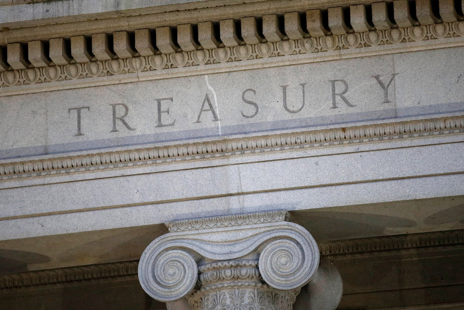 FILE- This photo shows the U.S. Treasury Department building at dusk in Washington, June 6, 2019. (AP Photo/Patrick Semansky, File)