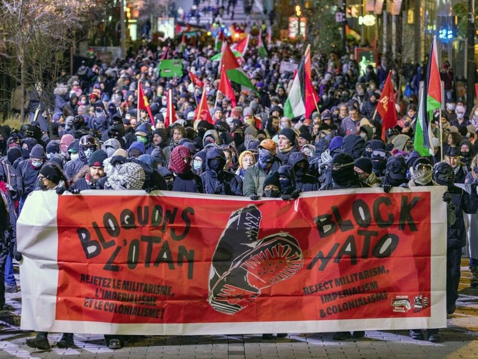 Demonstrators fill Ste-Catherine St. in Montreal during protests against the NATO Parliamentary Assembly in November 2024.