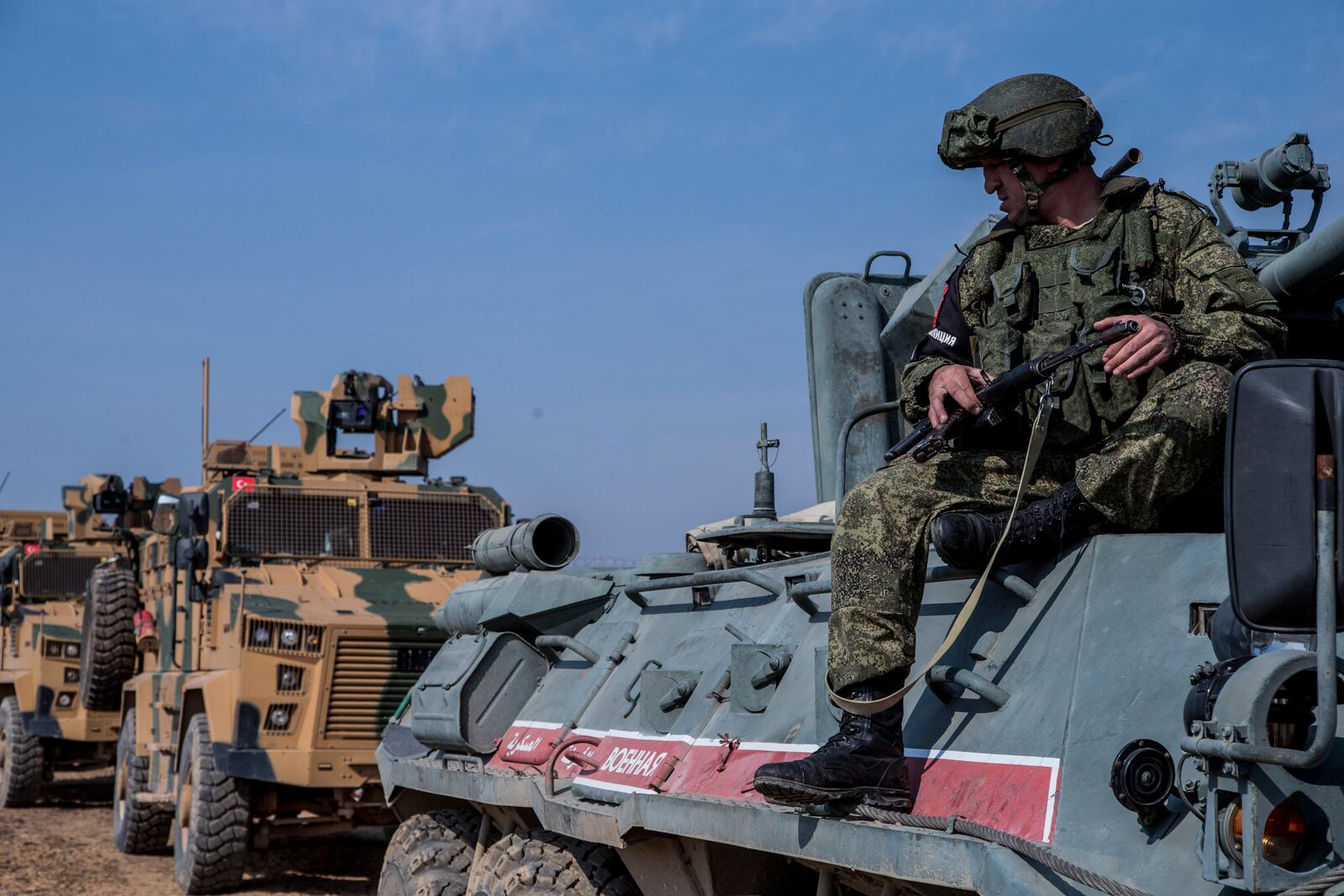 FILE - Turkish and Russian patrol is seen near the town of Darbasiyah, Syria, Friday, Nov. 1, 2019. (AP Photo/Baderkhan Ahmad, File)