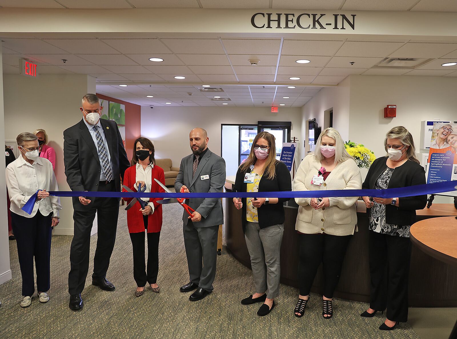 A ribbon is cut to officially open the new Premier Health Clinic at the Springfield Masonic Community Monday, April 4, 2022. BILL LACKEY/STAFF