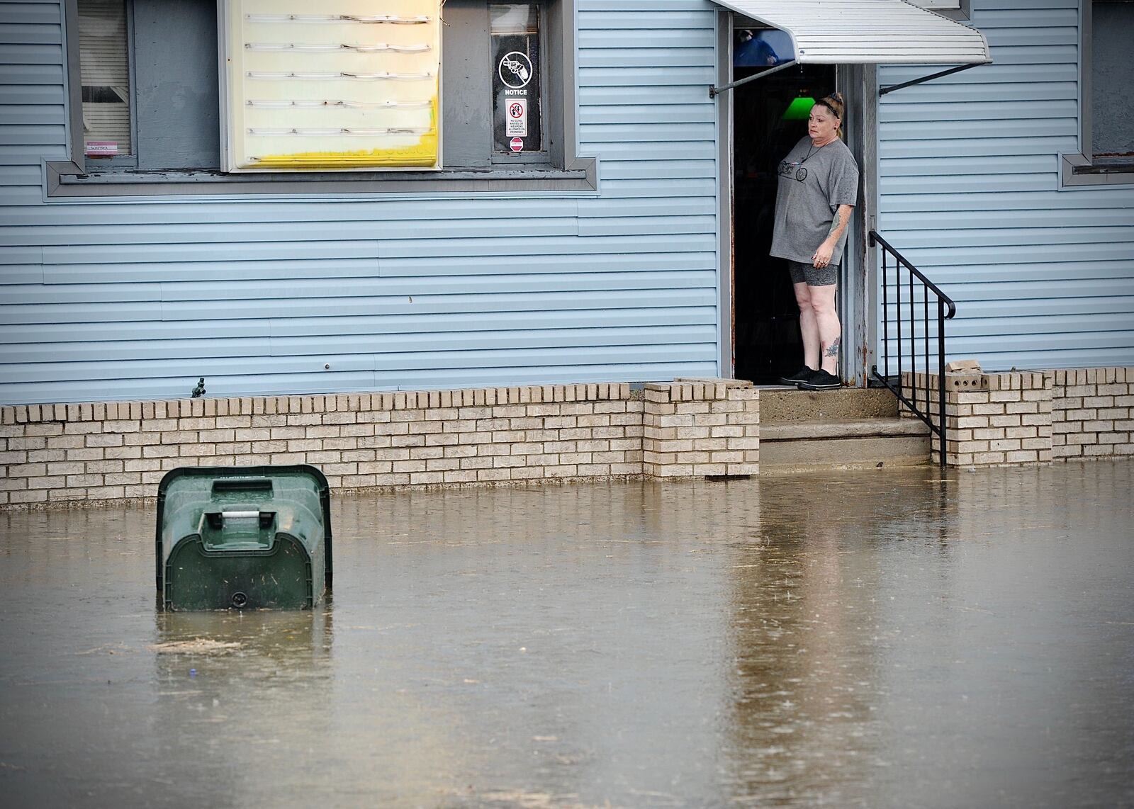 Torrence Street in Dayton was flooded Thursday, Aug. 26, 2021, after thunderstorms brought heavy rainfall. MARSHALL GORBY\STAFF