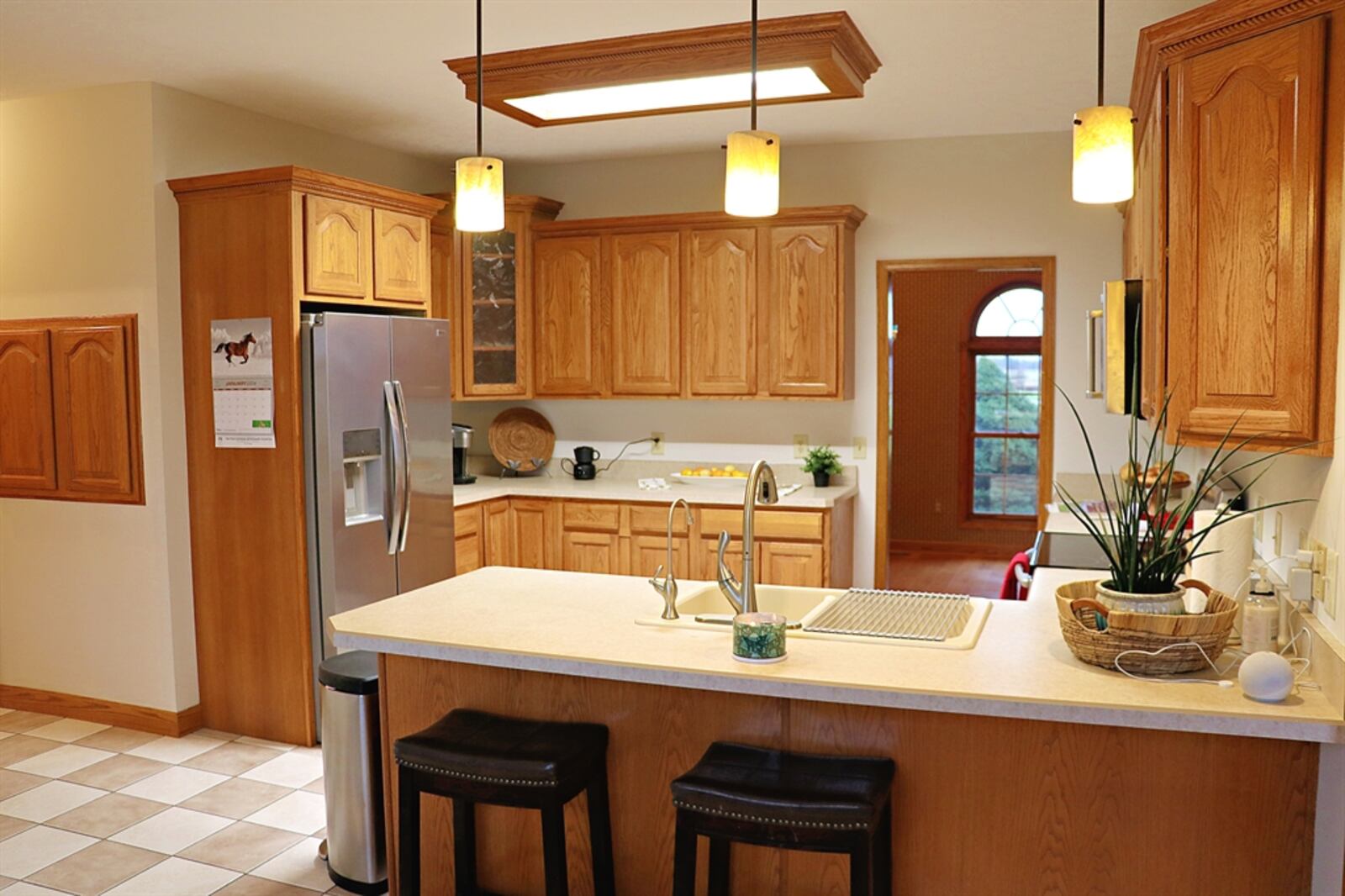 The kitchen has an abundance of oak cabinetry and Corian counters. CONTRIBUTED BY KATHY TYLER 