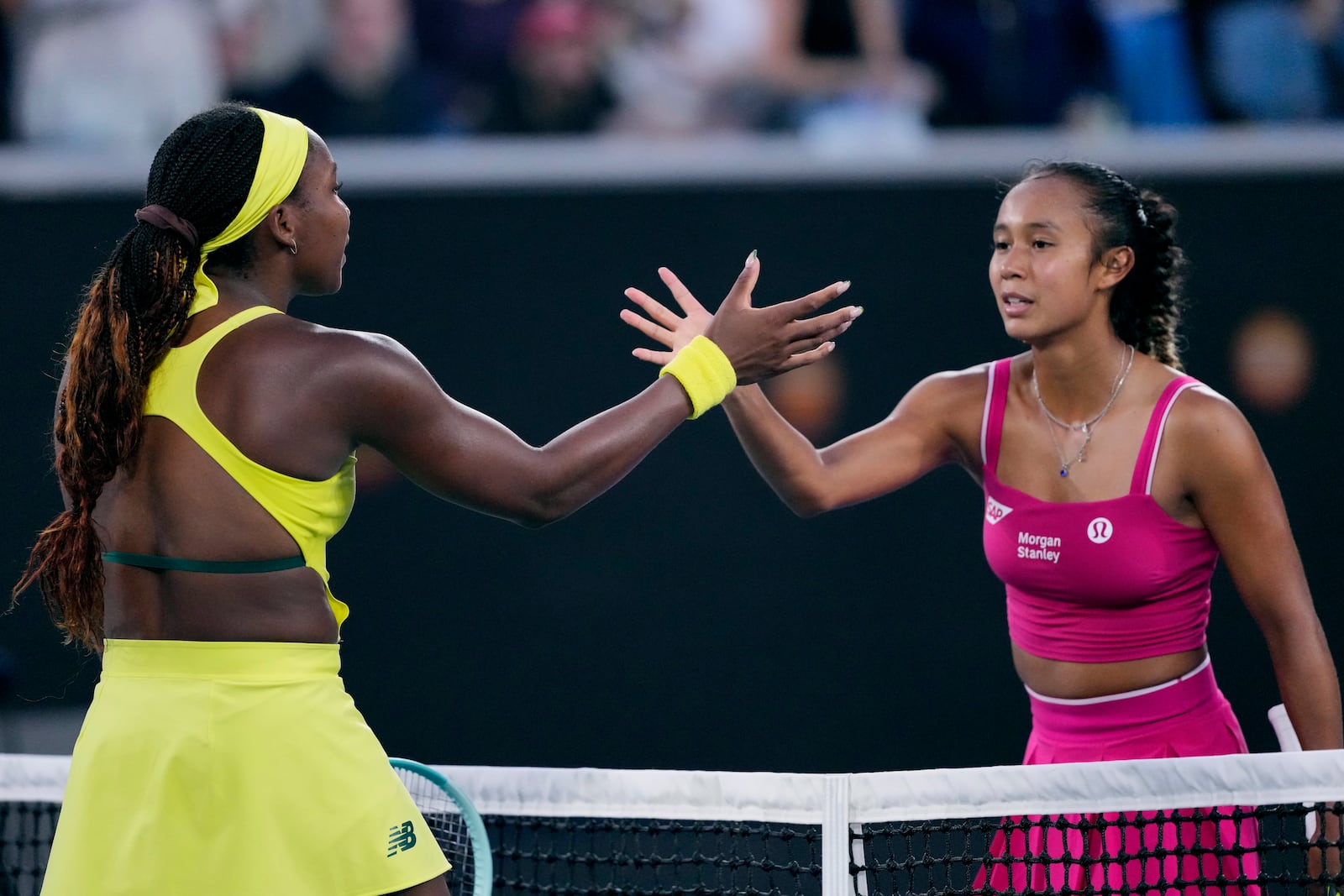 Coco Gauff, left, of the U.S. is congratulated by Leylah Fernandez of Canada following their third round match at the Australian Open tennis championship in Melbourne, Australia, Friday, Jan. 17, 2025. (AP Photo/Vincent Thian)