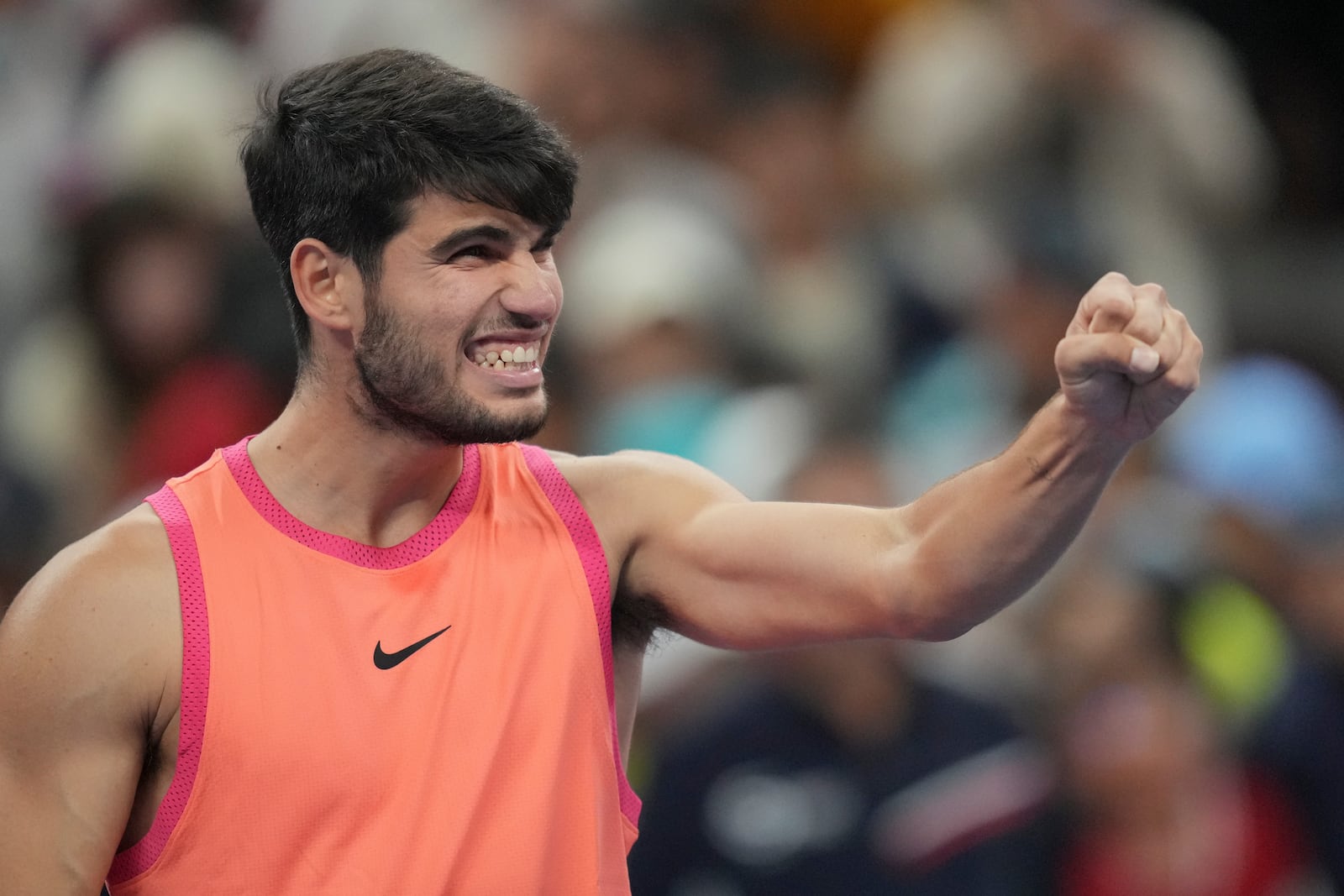 Carlos Alcaraz of Spain reacts after winning against Jannik Sinner of Italy during their men's singles finals match of the China Open tennis tournament, at the National Tennis Center in Beijing, Wednesday, Oct. 2, 2024. (AP Photo/Achmad Ibrahim)