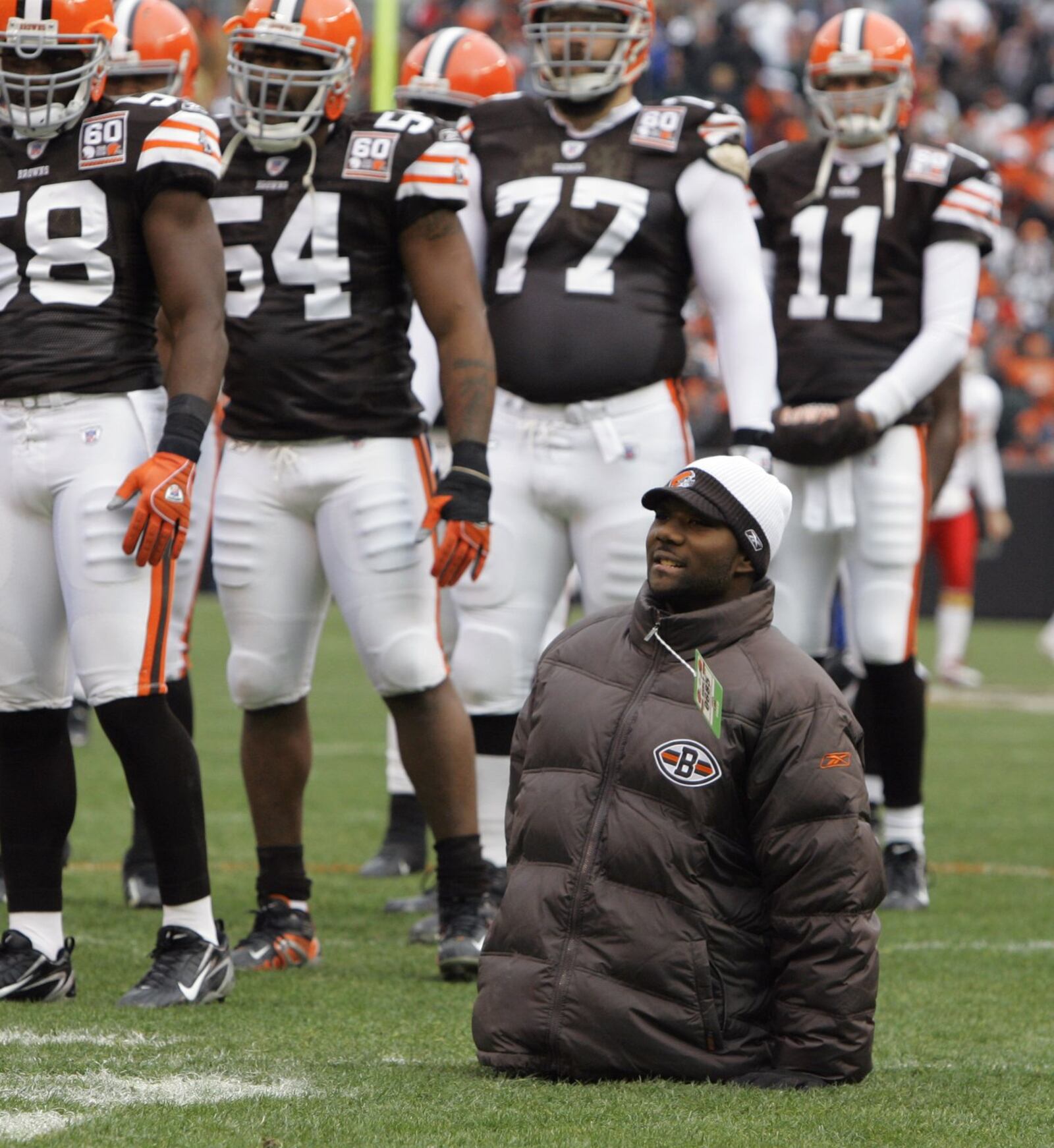 Bobby Martin from Dayton, Ohio, watches the Cleveland Browns warm up before their 31-28 overtime over the Kansas City Chiefs in an NFL football game Sunday, Dec. 3, 2006, in Cleveland. Martin, who was born without legs, played high school football in his home town. (AP Photo/Tony Dejak)