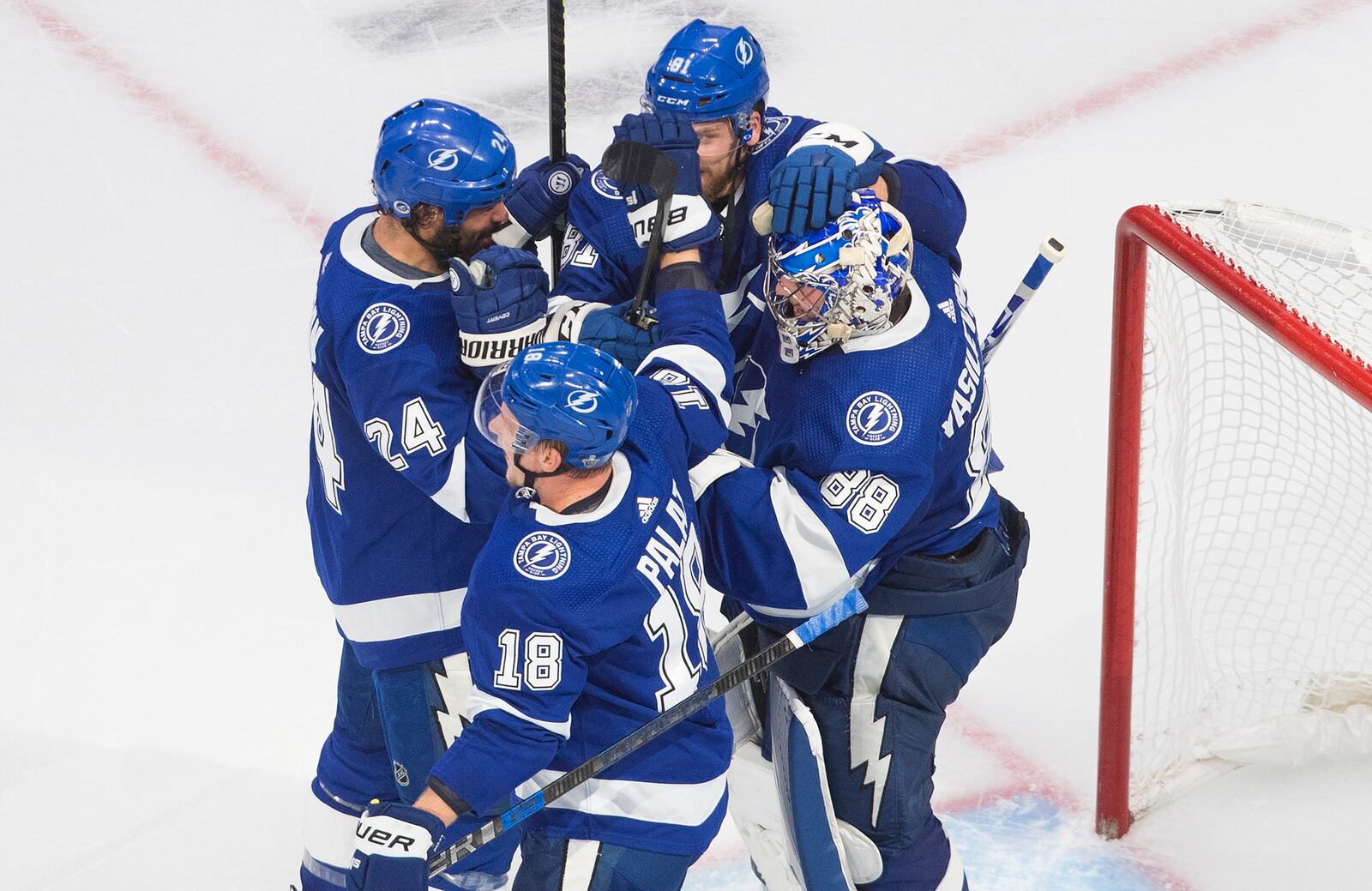 Tampa Bay Lightning goalie Andrei Vasilevskiy (88) celebrates with teammates after the team's win over the New York Islanders in Game 2 of the NHL hockey Eastern Conference final, Wednesday, Sept. 9, 2020, in Edmonton, Alberta. (Jason Franson/The Canadian Press via AP)