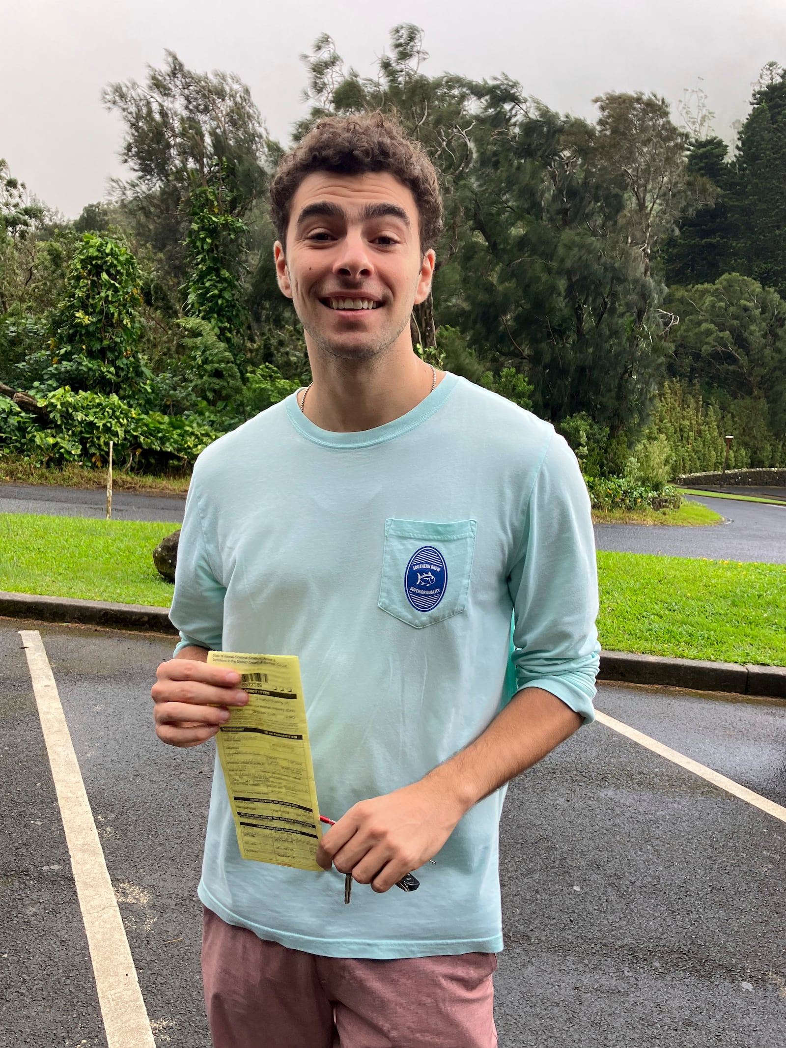 This photo, provided by the Hawaii Dept. of Land and Natural Resources, shows Luigi Mangione, a suspect in the fatal shooting of UnitedHealthcare CEO Brian Thompson, receiving a citation for failing to observe a posted closed-area sign, in Honolulu, Sunday, Nov. 12, 2023. (Hawaii Dept. of Land and Natural Resources via AP)