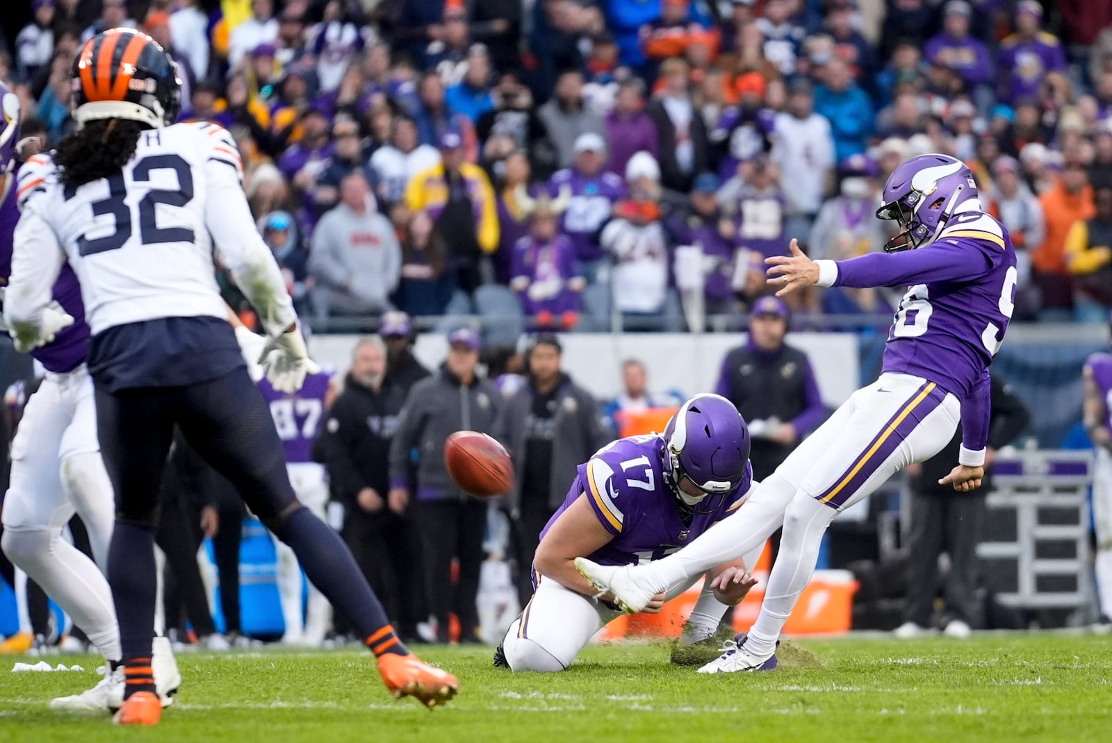 Minnesota Vikings place kicker Parker Romo, right, makes the game-wining field goal in overtime of an NFL football game against the Chicago Bears, Sunday, Nov. 24, 2024, in Chicago. (AP Photo/Erin Hooley)