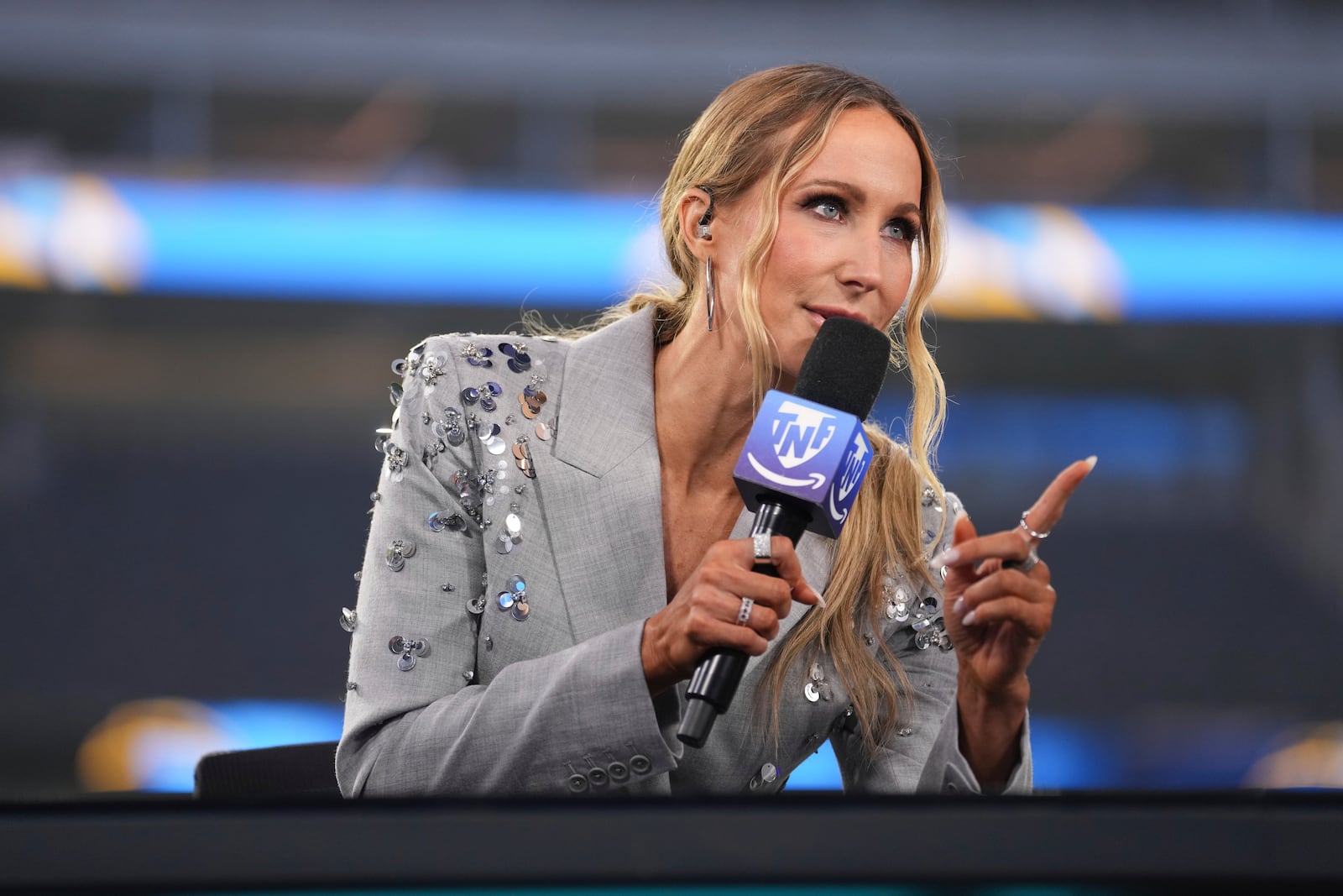 Nikki Glaser participates in a segment after an NFL football game between the Los Angeles Chargers and the Denver Broncos, Thursday, Dec. 19, 2024, in Inglewood, Calif. (AP Photo/Eric Thayer)