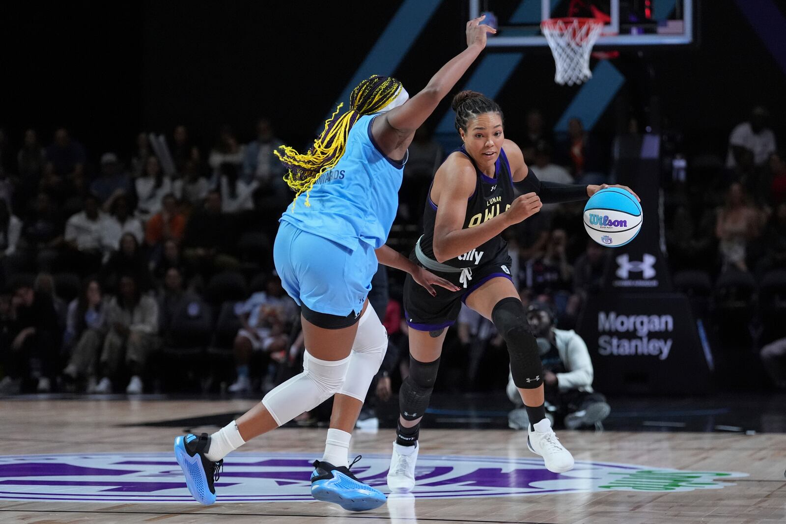 Napheesa Collier, right, drives past Aaliyah Edwards in the Unrivaled 1-on-1 basketball final, Friday, Feb. 14, 2025, in Medley, Fla. (AP Photo/Rebecca Blackwell)