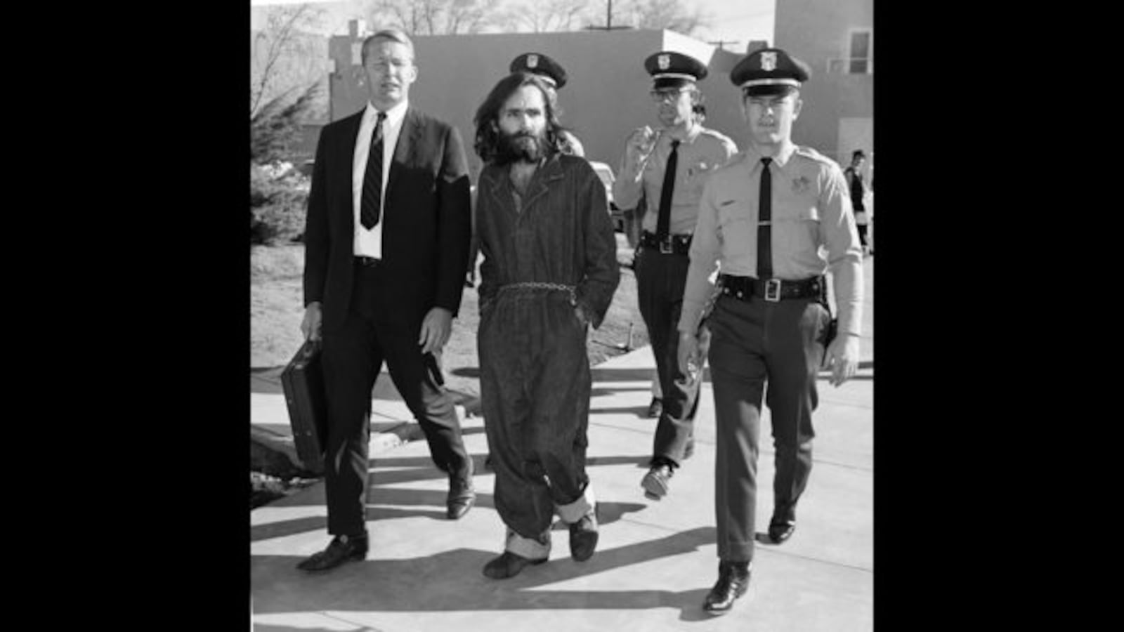 This Dec. 3, 1969, file photo shows Charles Manson en route to court in Independence, Calif., following his arrest at nearby Barker Ranch. AP Photo