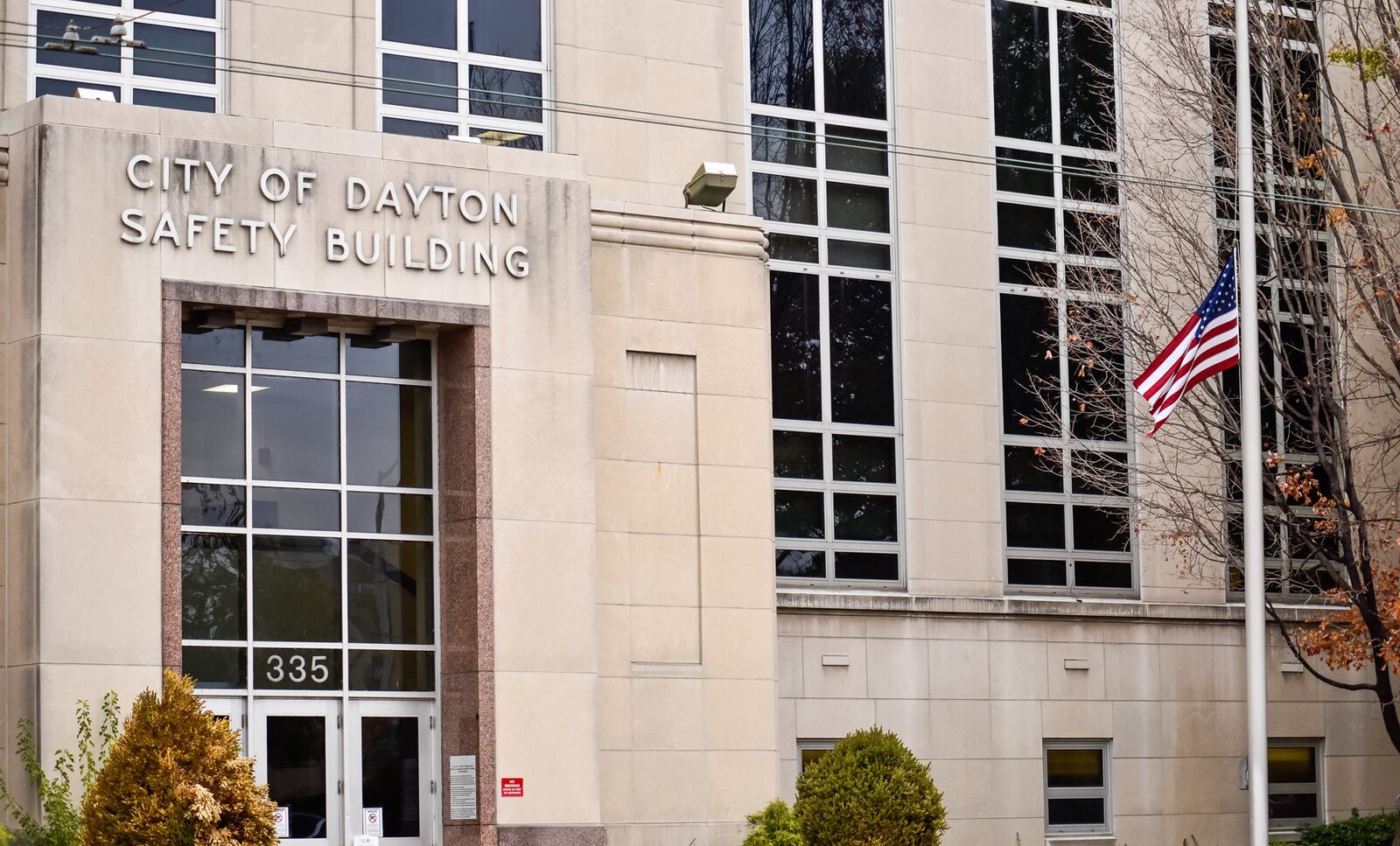 The flag was at half-staff in front of the City of Dayton Safety Building Thursday in honor of Dayton Police Det. Jorge Del Rio, who died Thursday after he was shot Monday night in the line of duty. Del Rio was transported from Grandview Hospital to Montgomery County Coroner's office in a Dayton. People lined the entrance along West Third Street for the processional lead by fellow Dayton police officers. NICK GRAHAM/STAFF