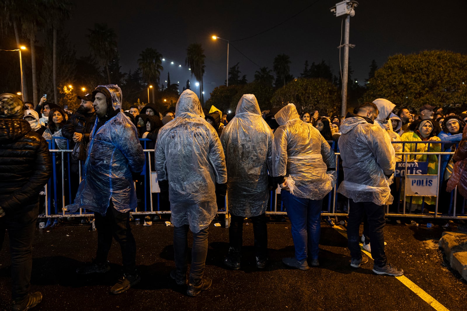 Police stand guard as people gather to mark the two-year anniversary of the country's catastrophic earthquake, in Antakya, southern Turkey, early Thursday, Feb. 6, 2025. (Ugur Yildirim/Dia Photo via AP)