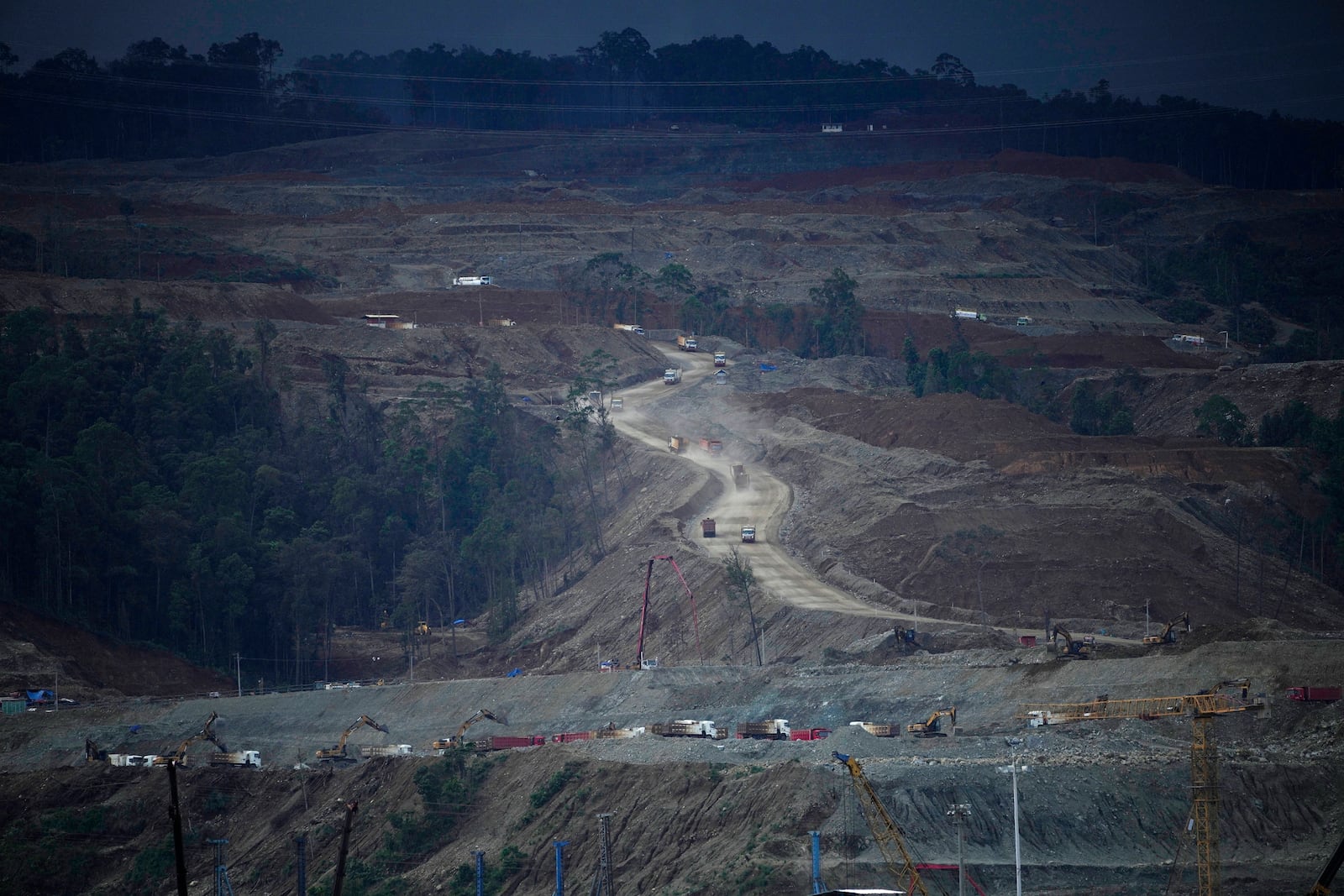 FILE - Dump trucks maneuver at Indonesia Weda Bay Industrial Park in Central Halmahera, North Maluku province, Indonesia, on June 8, 2024. (AP Photo/Achmad Ibrahim, File)