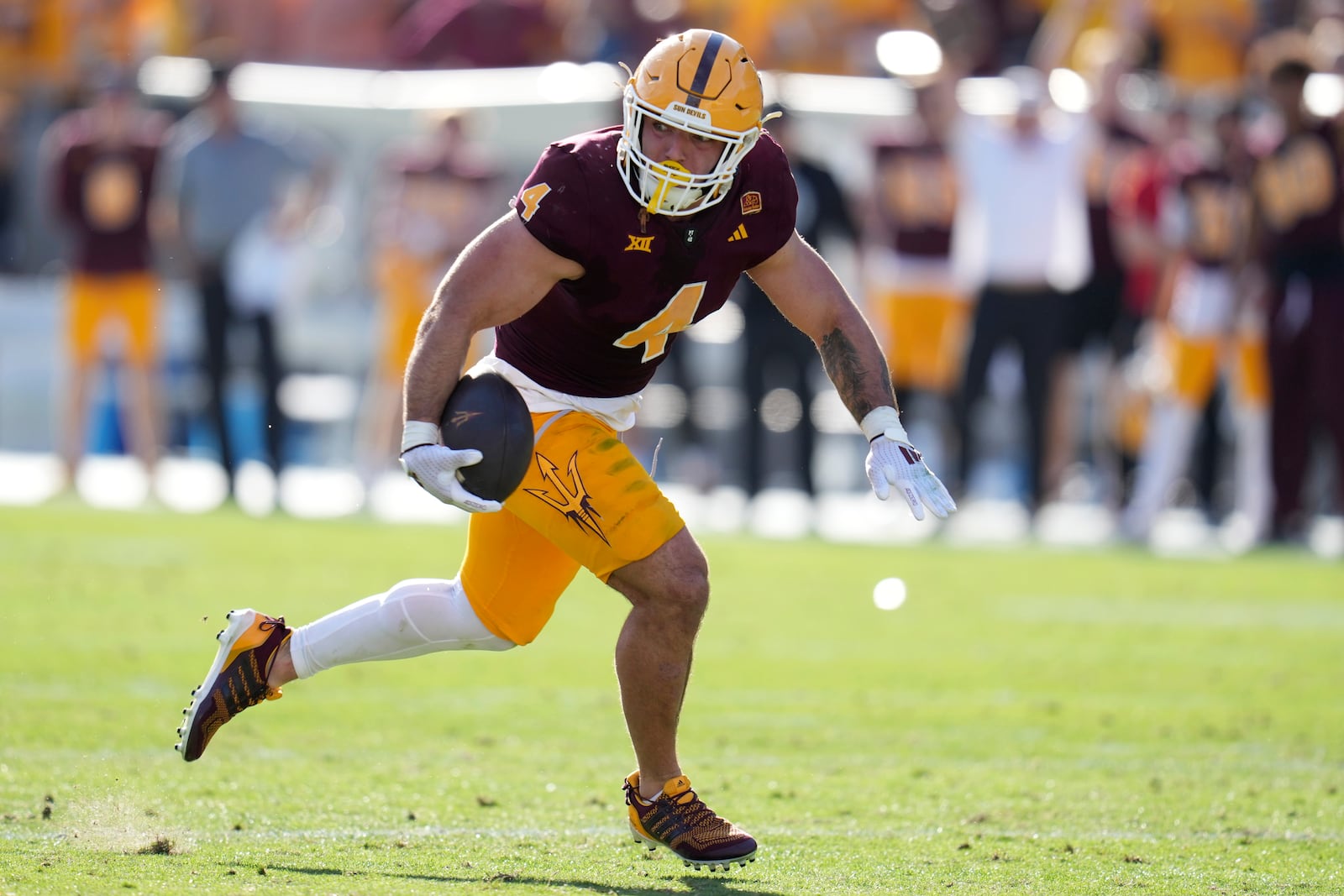 Arizona State running back Cam Skattebo runs for a touchdown against BYU during the first half of an NCAA college football game Saturday, Nov. 23, 2024, in Tempe, Ariz. Arizona State won 28-23. (AP Photo/Ross D. Franklin)